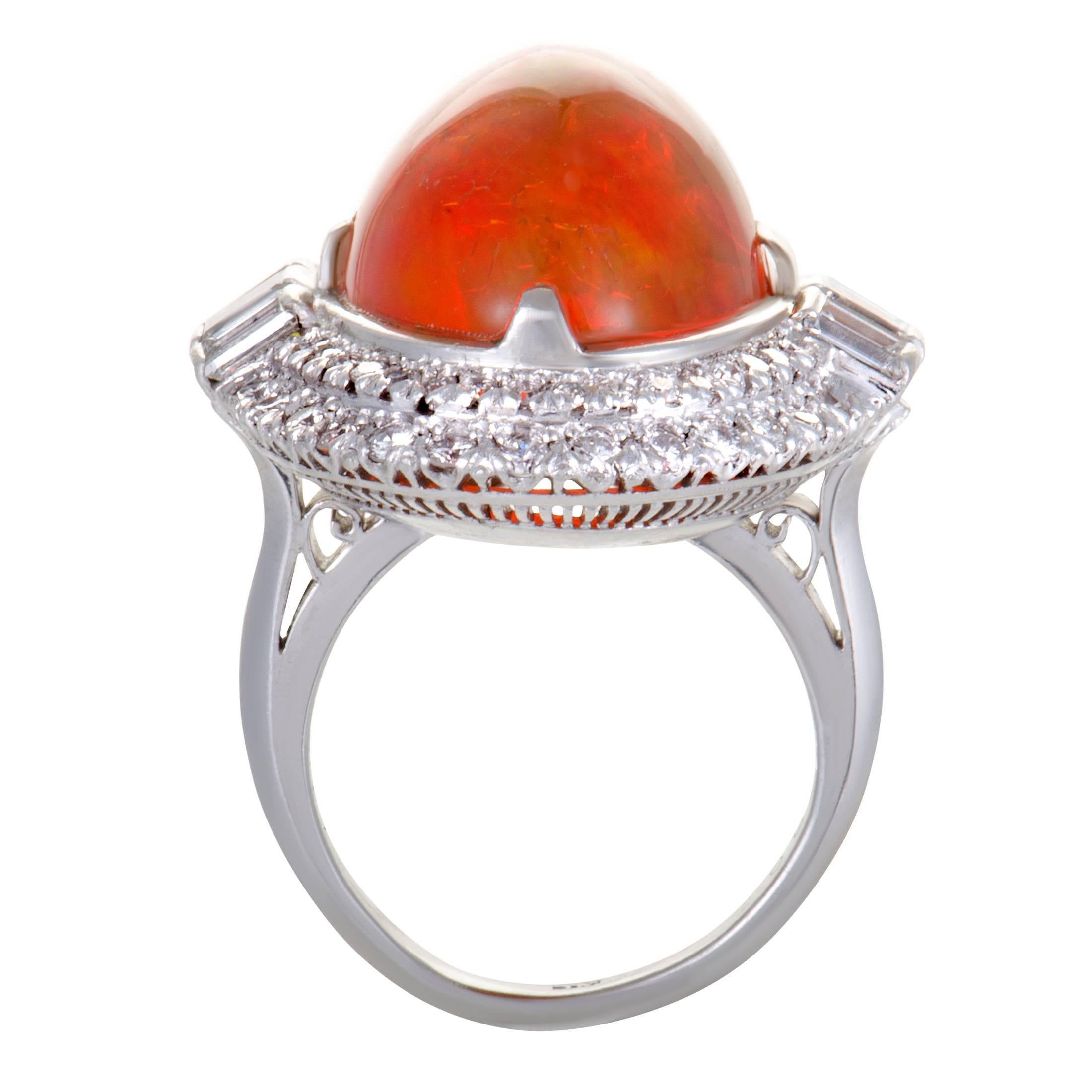 The intriguing fire opal in this ring is surrounded in a spectacular fashion by resplendent diamonds, offering an incredibly luxurious, eye-catching appearance. Made of platinum, the ring boasts a total of 2.07 carats of diamonds, while the opal