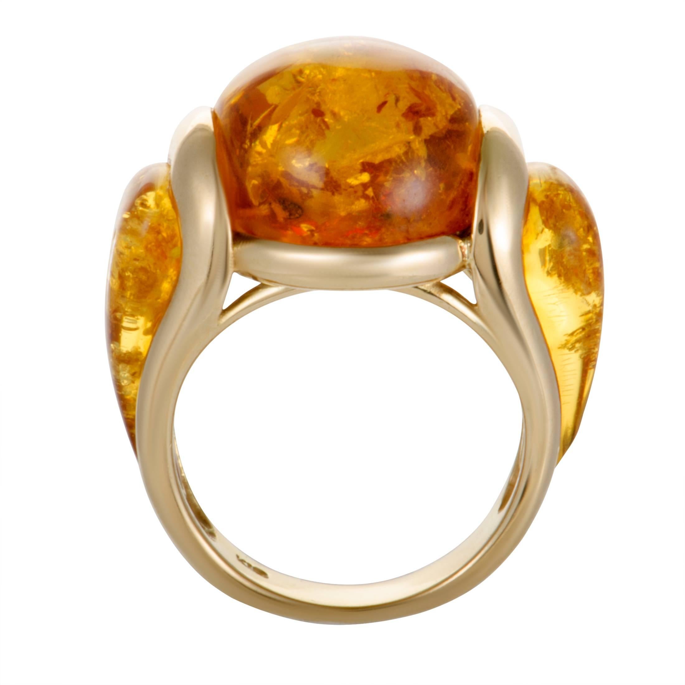 The intriguing amber lends its ever-present allure to this stunning ring that boasts an exceptionally harmonious, yet incredibly eye-catching appearance. The ring is made of radiant 18K yellow gold and weighs 10.5 grams.
Ring Size: 6.25
Ring Top