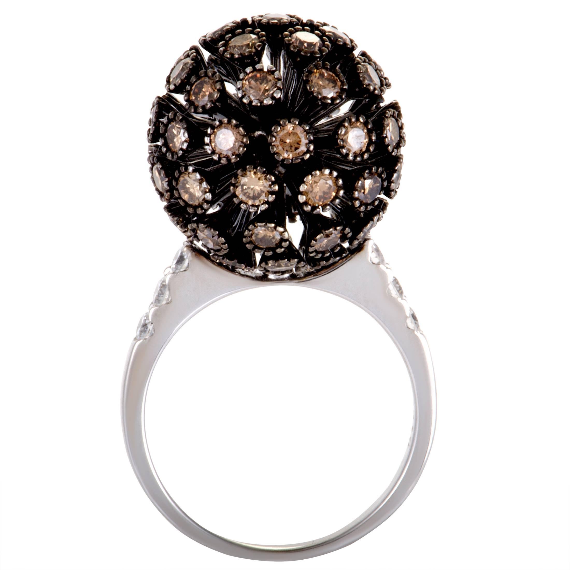 A compelling twist is given to this eye-catching ring with black rhodium plating, making it a piece of exceptional aesthetic allure. The ring is made of 18K white gold and embellished with diamonds that weigh in total 3.52 carats.
Ring Size: