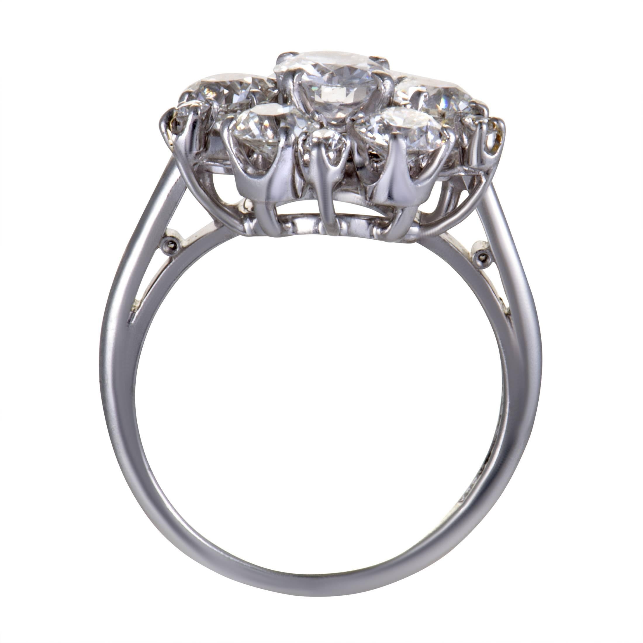 Reminiscent of a sparkly snowflake with its coolly gleaming platinum body and magnificent diamond-setting, this antique ring boasts a wonderfully extravagant appeal. The ring weighs 7.5 grams and the diamonds total approximately 2.20 carats.
Ring