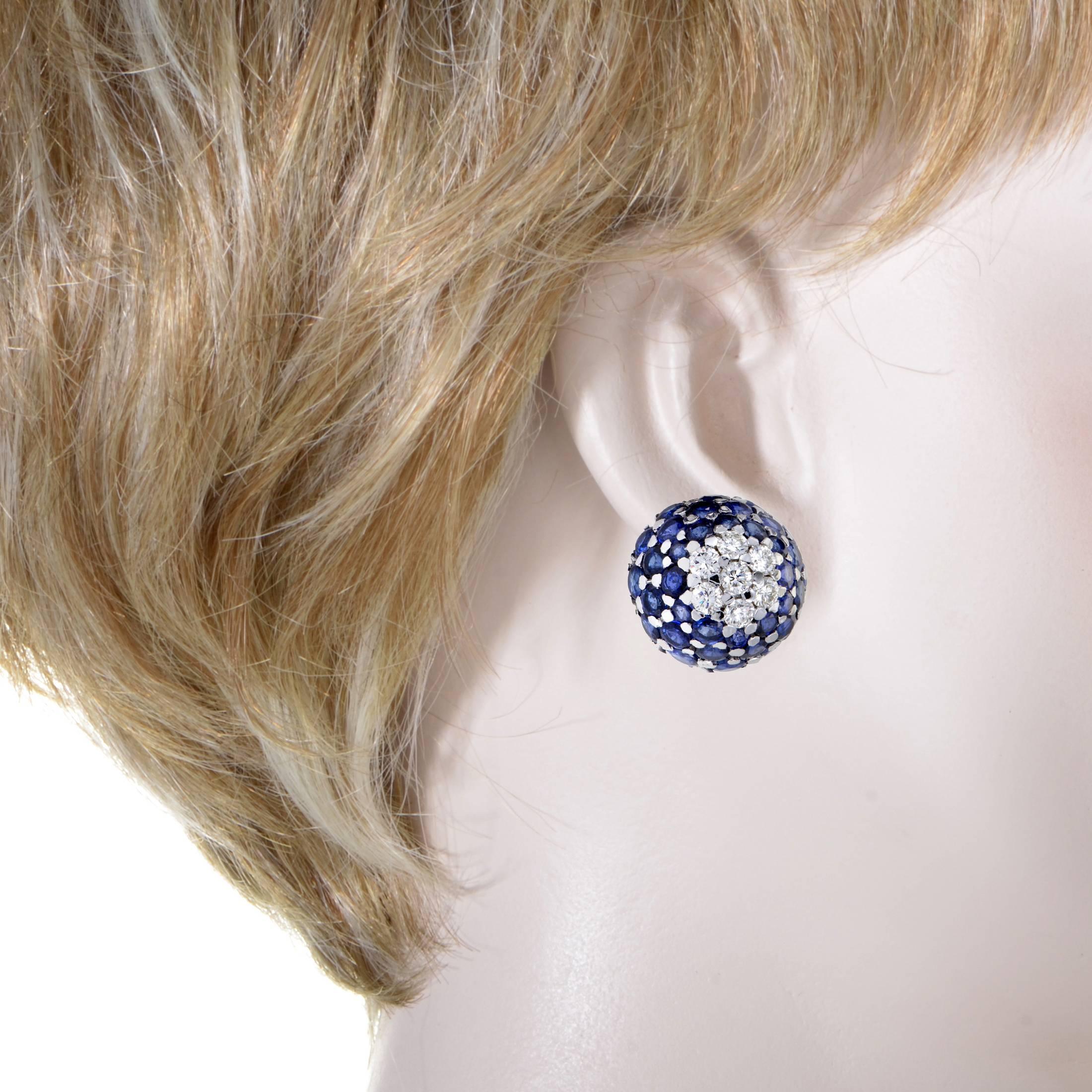 Incredibly stylish and extraordinarily embellished, these gorgeous earrings offer a delightfully feminine appearance. The pair is made of elegant 18K white gold and set with sparkly diamonds and stunning sapphires that total approximately 3.50 and
