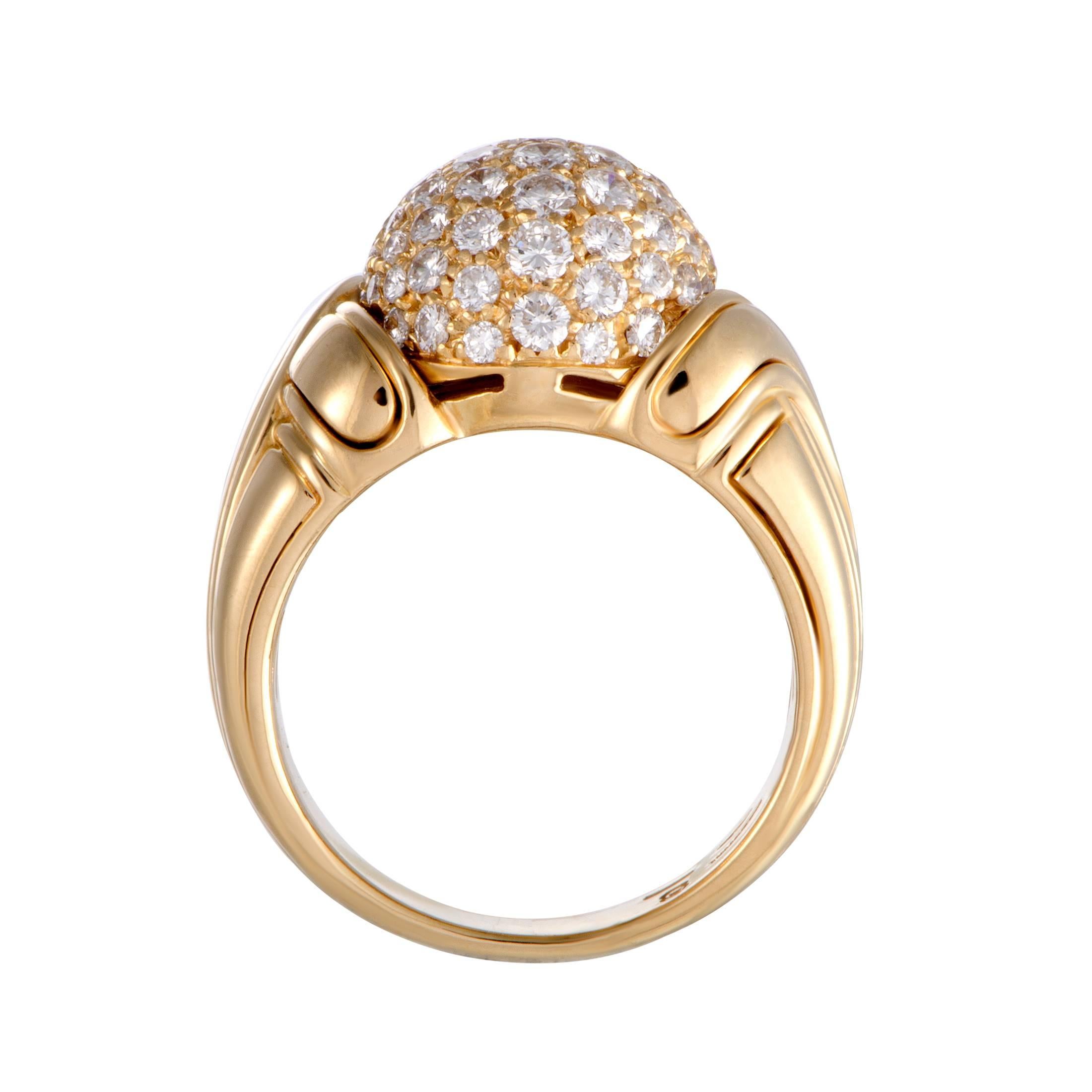 Designed in a splendidly elegant manner and luxuriously decorated with resplendent diamonds, this stunning Bulgari ring exudes prestige and refinement. The ring is made of 18K yellow gold and set with a total of approximately 1.20 carats of