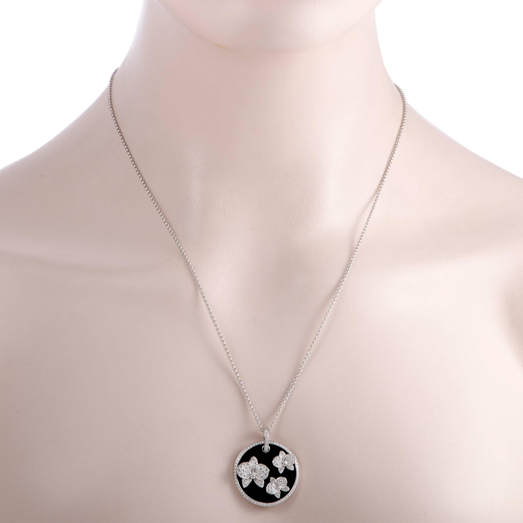 Perfect if you want to complete your look with an eye-catching high-end piece, this “Caresse d'orchidées par Cartier” necklace is made of elegant 18K white gold and features a delightful pendant that boasts striking onyx and gorgeous diamond-set