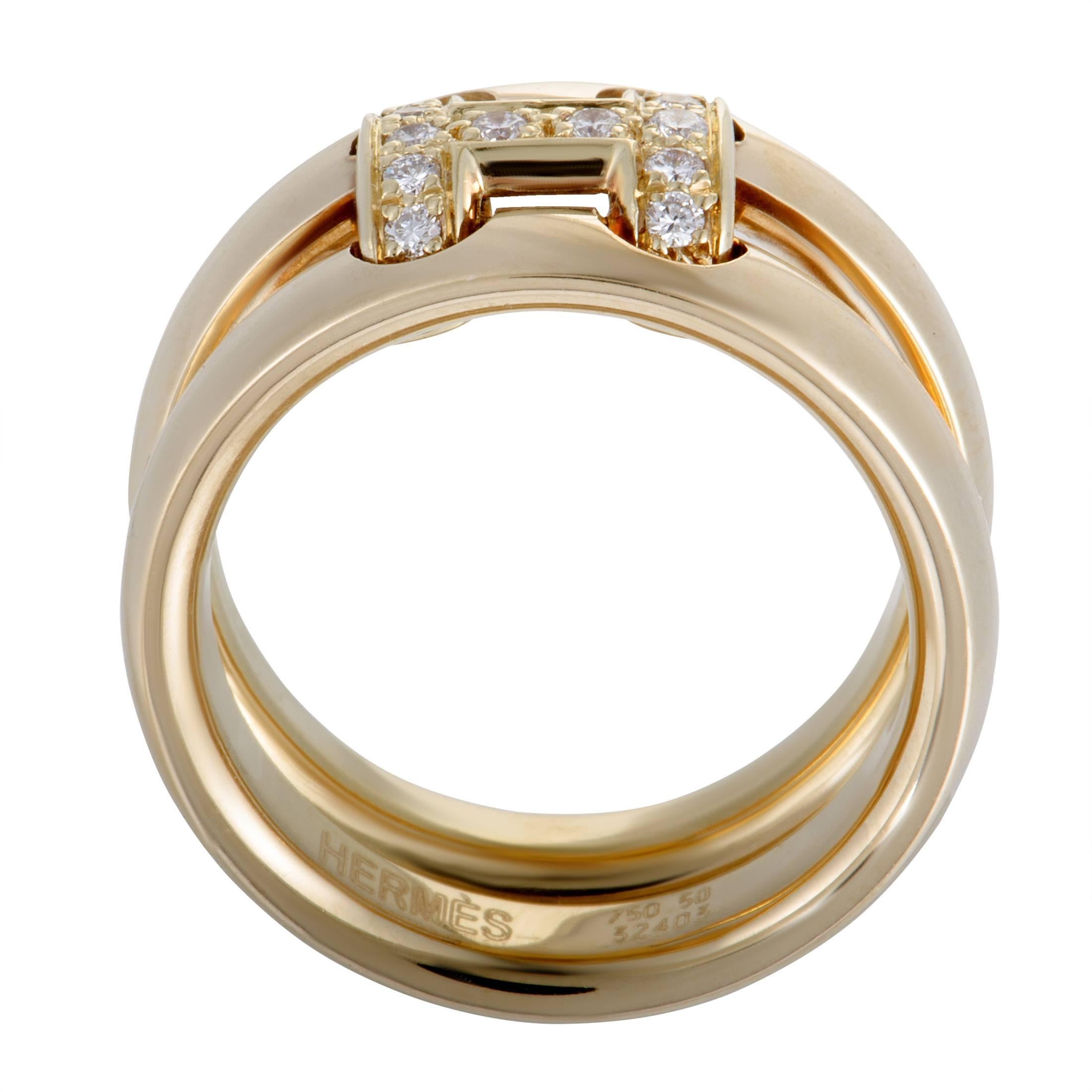 Graced with the iconic “H” that immediately sets apart the highly revered Hermès pieces, this stunning ring offers an exceptionally refined appearance. The ring is made of 18K yellow gold and niftily embellished with scintillating diamond