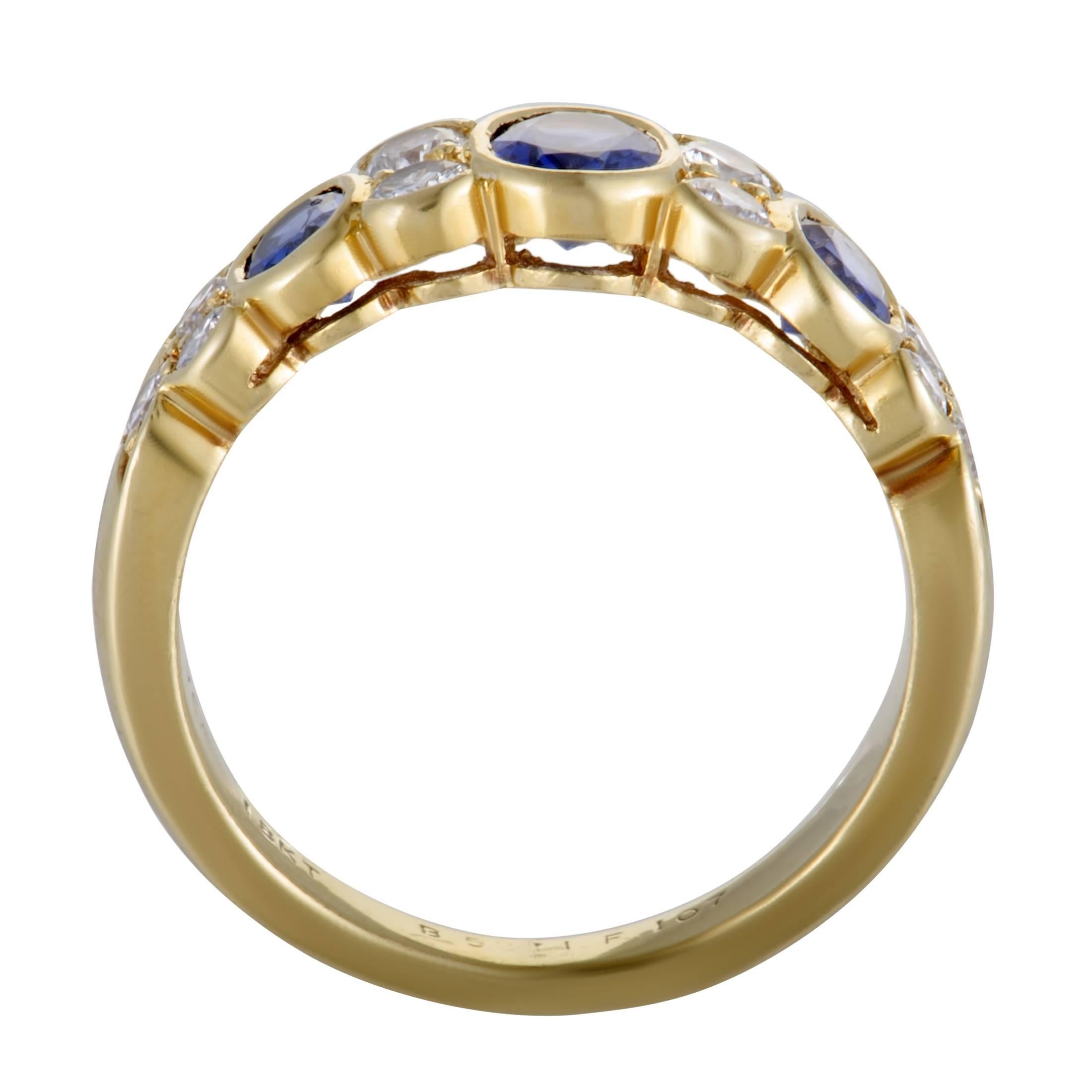 Featuring the incredibly luxurious combination of classy 18K yellow gold, glamorous diamonds and regal sapphires, this gorgeous Van Cleef & Arpels ring offers an exceptionally sophisticated appearance. The sapphires weigh in total 1.00 carat, and