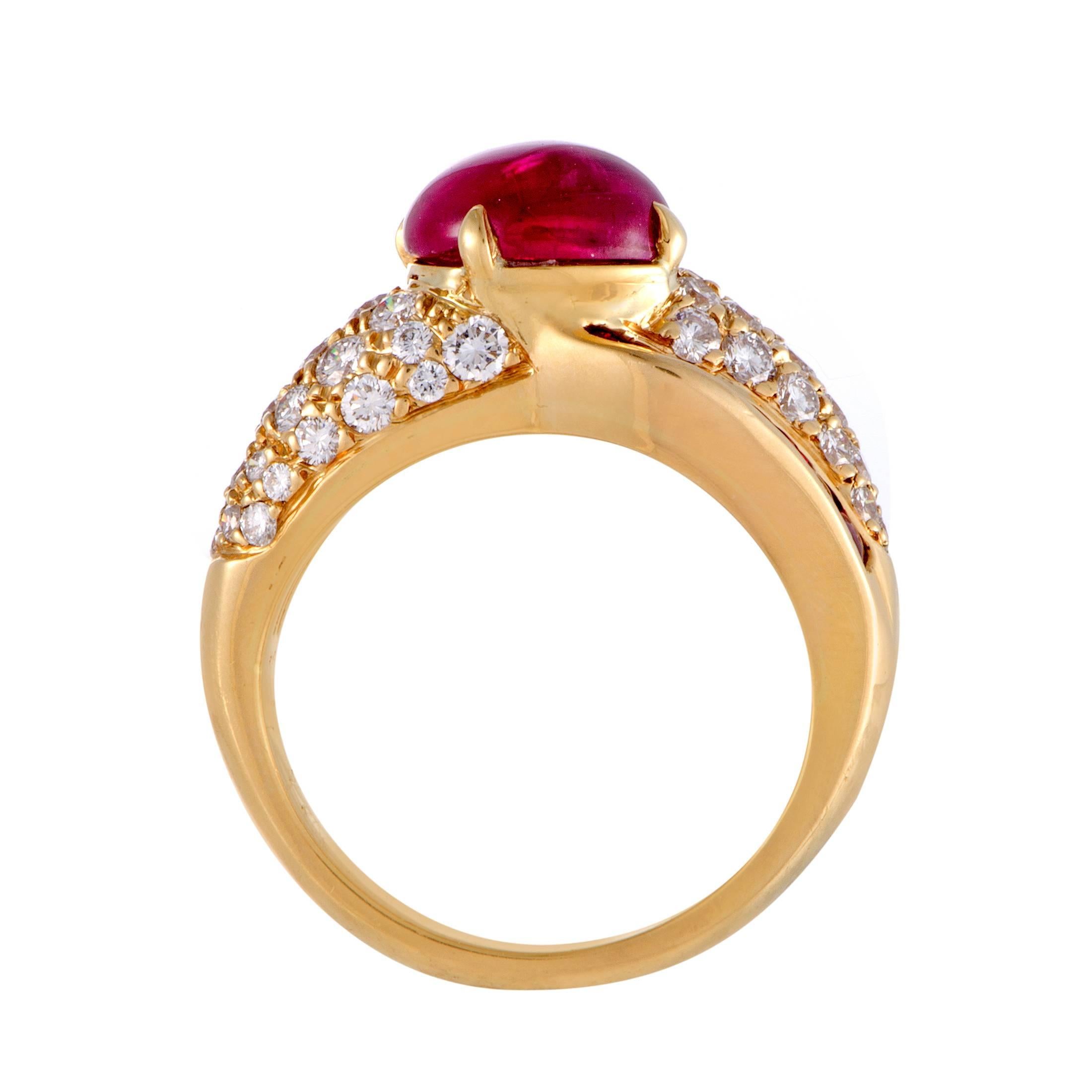 Producing a sight of spellbinding luxury and femininity, the fabulous 18K yellow gold is embellished with a fascinating blend of approximately 1.10 carats of diamonds and approximately 0.70 carats of rubies while the fantastic cabochon ruby weighing