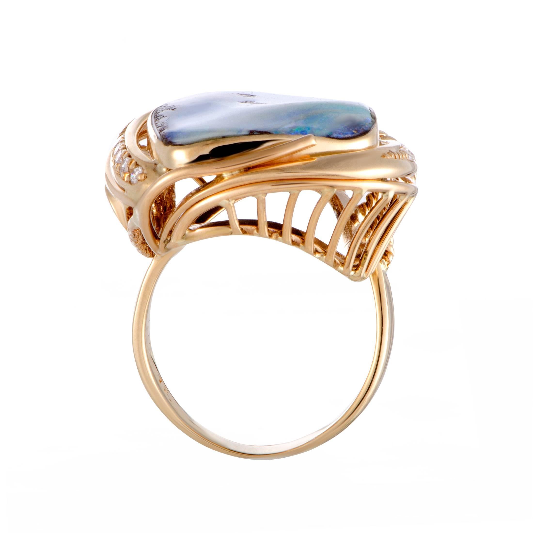 The star of the show in this spectacular ring is the captivating opal with its sublime, endearing shades. This exquisite stone is wonderfully complemented by the alluring 18K yellow gold accentuated with scintillating diamonds that weigh 0.10 carats