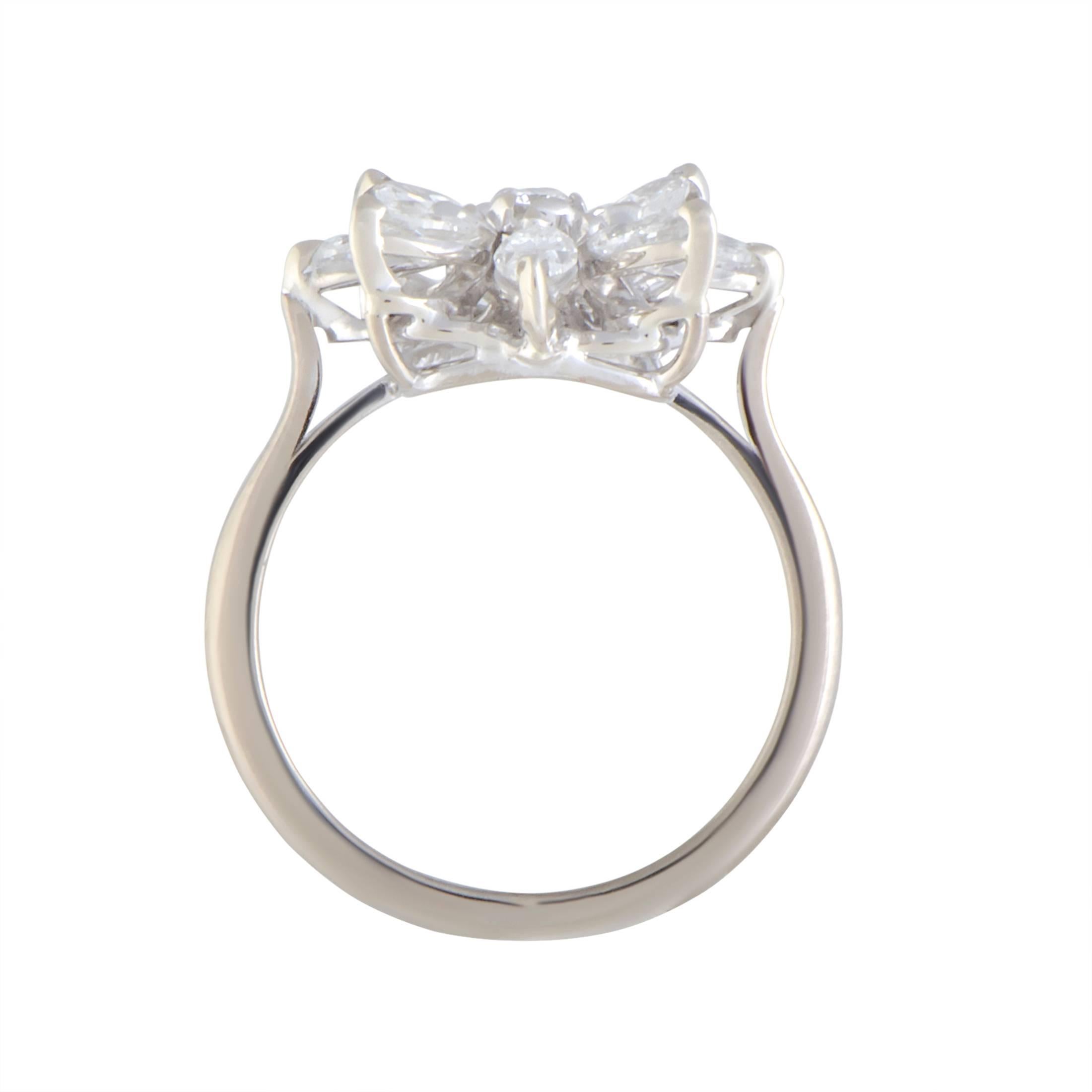 Exquisitely cut and brilliantly arranged to tantalizingly resemble a delicate flower enriched with prestigious glisten, the glorious diamonds amounting to 1.00 carat are proudly presented upon this truly fascinating 18K white gold ring from