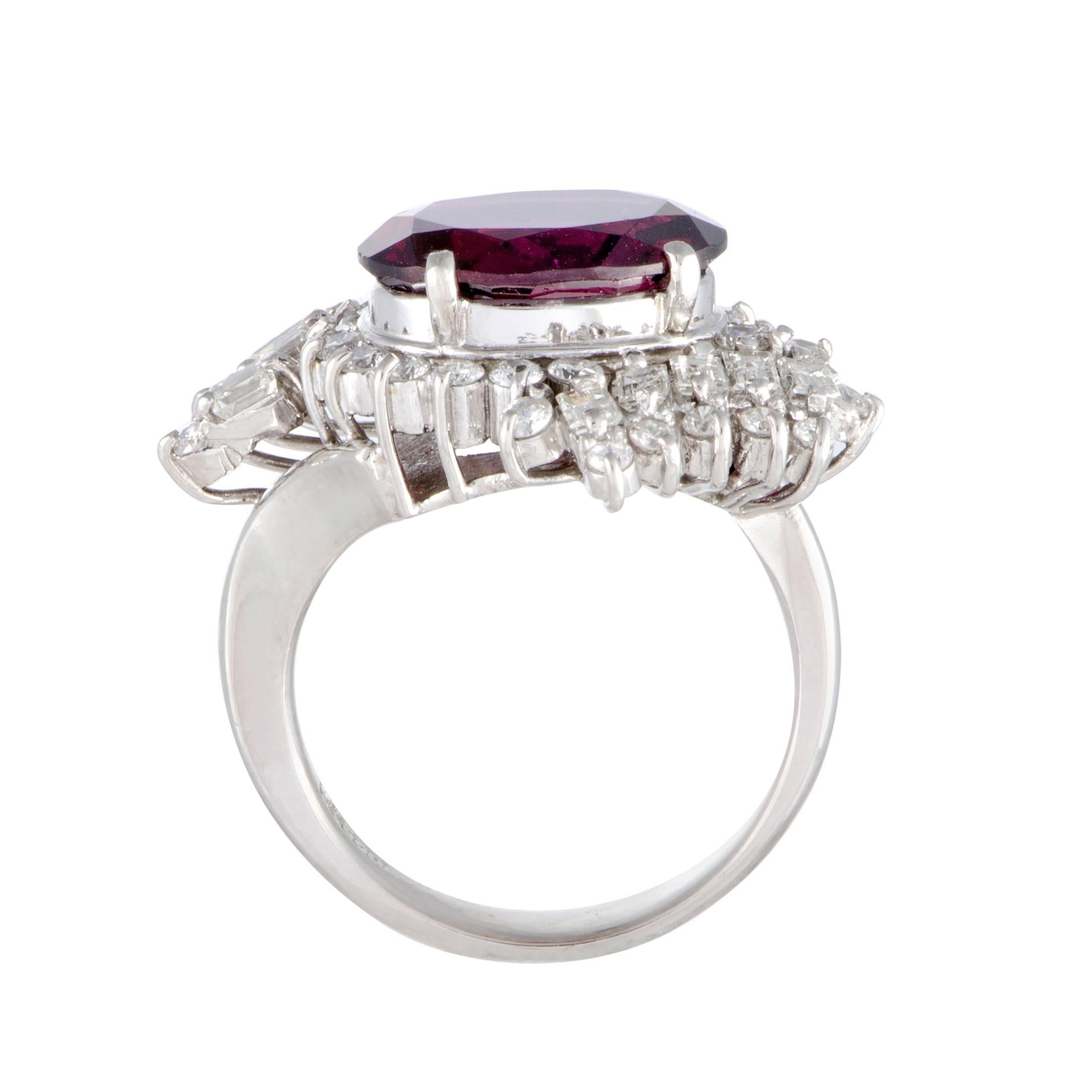 The captivating nuance of tourmaline stands out in magnificent fashion against the luxuriously bright tones of resplendent diamonds and gleaming platinum in this stunning ring. The tourmaline weighs 4.67 carats and the diamond stones total 0.94
