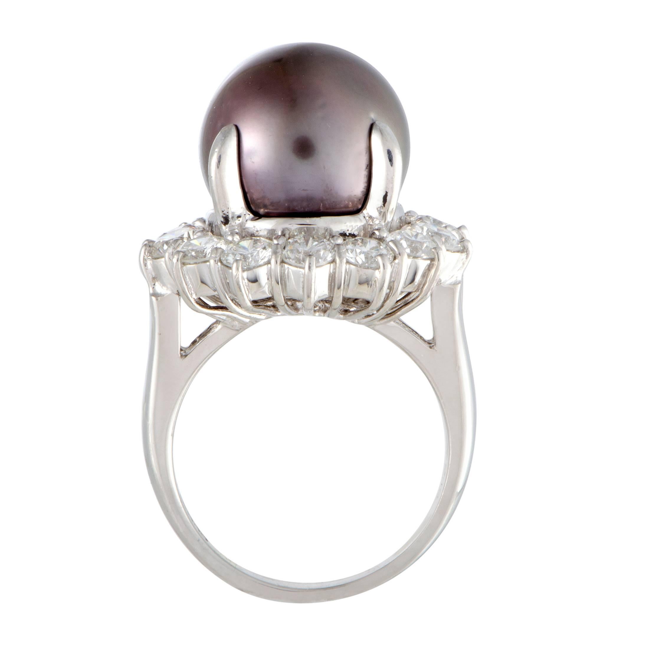 A compelling black pearl takes the central place in this gorgeous ring, lending its sophisticated allure to the piece. The ring is made of platinum and also boasts diamonds that weigh 2.01 carats in total.
Ring Size 6.25
Band 2mm
Top 18mm
Dimension: