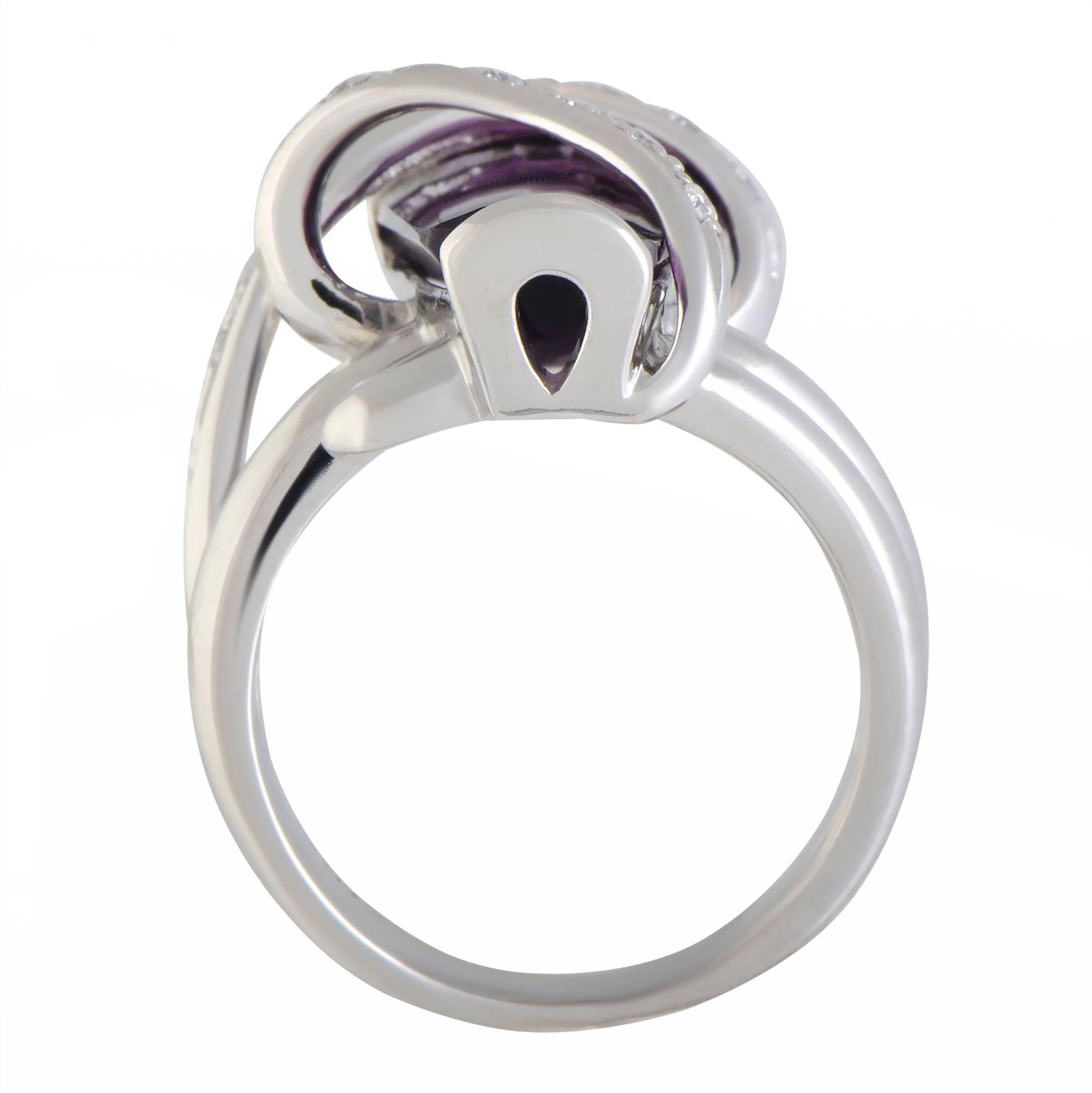 Presented in prestigious platinum and featuring a compellingly offbeat design, this ring offers an exceptionally eye-catching, fashionable appearance. The ring is set with 0.20 carats of diamonds and boasts a captivating amethyst that weighs
