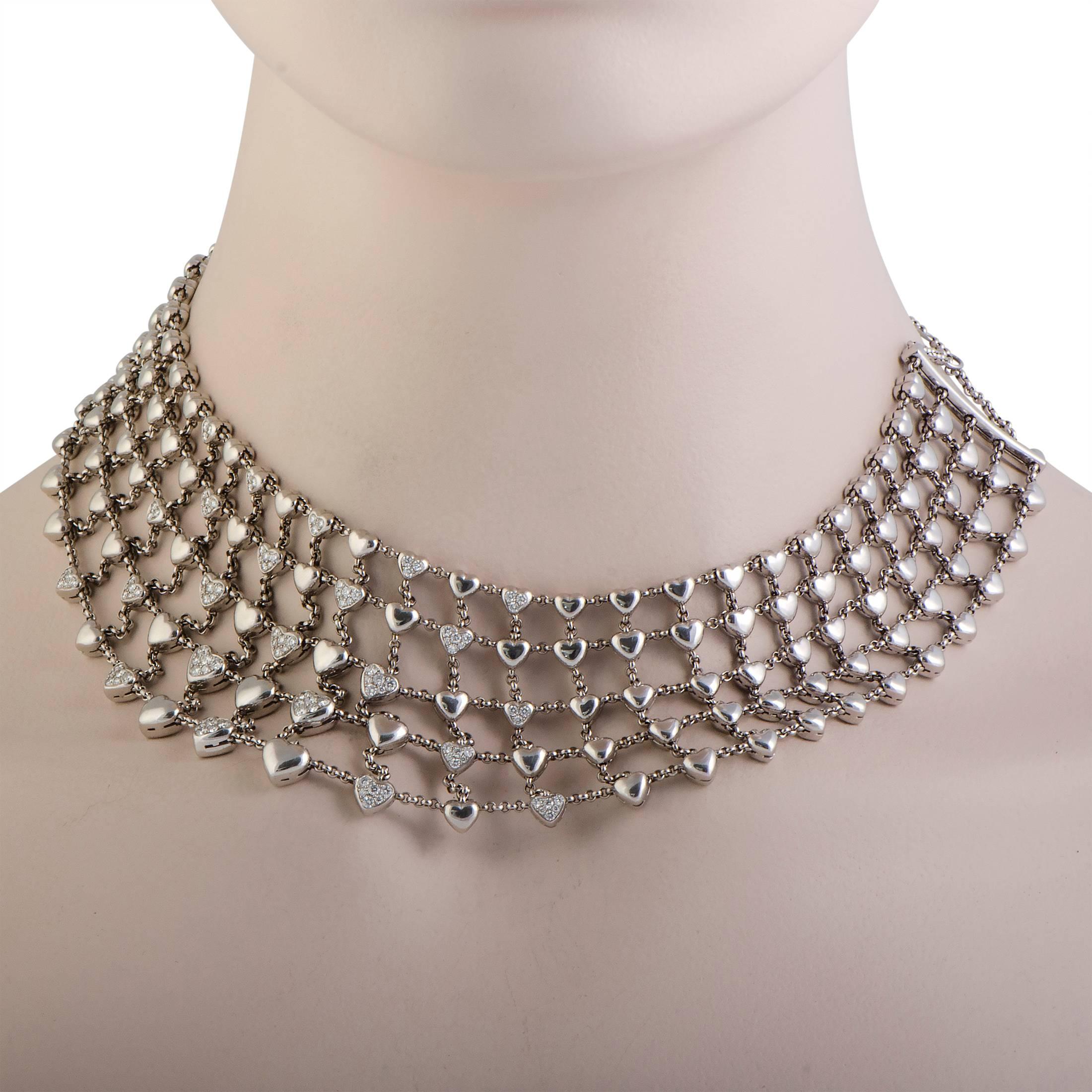 This stunning 18K white gold bib necklace by Chopard is the perfect accessory for your outfit! The spectacular design includes layers of dazzling diamond studded hearts that give the necklace an extravagantly stylish appeal. The total diamond carat