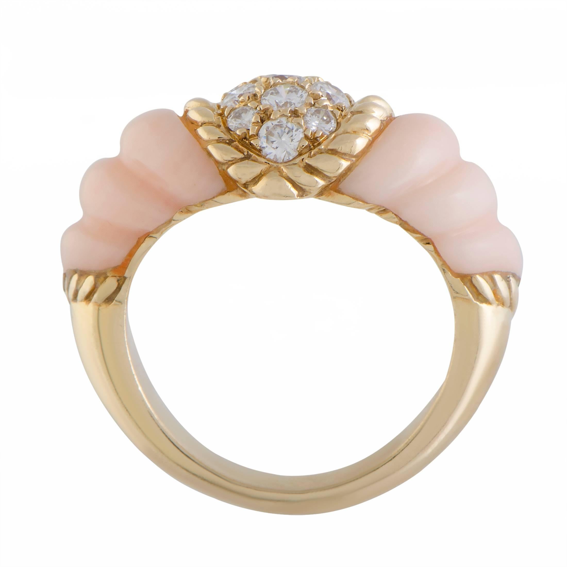 Style and elegance are embodied in this gorgeous 18K yellow gold vintage ring by Boucheron. The sensational ring sparkles with 0.40ct of stunning diamonds surrounded by a beautiful use of coral that reflects the luxurious value of the spectacular