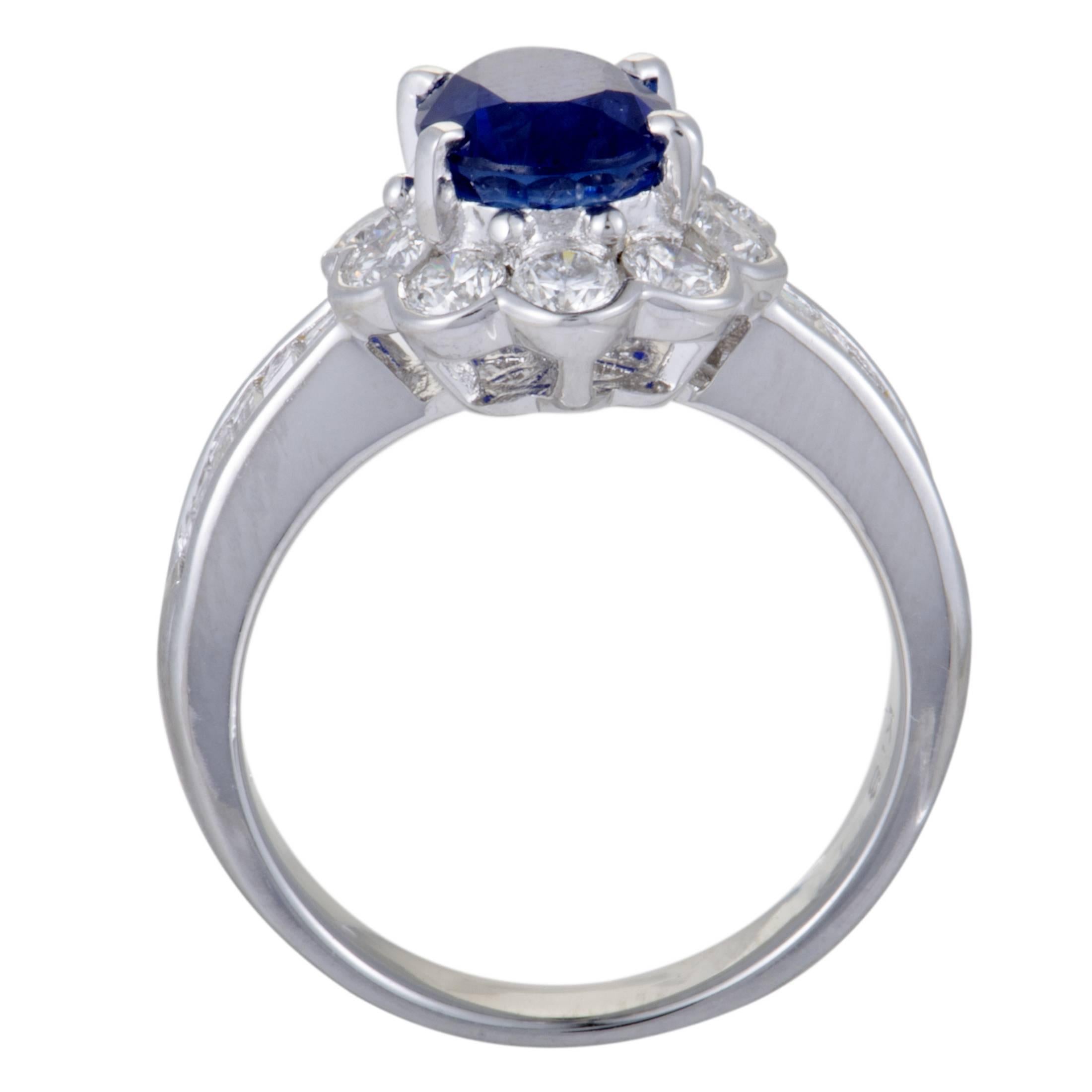 Gorgeously designed and exquisitely crafted from 18K white gold, this ring is given an attractive, prestigious appearance by the sumptuous combination of resplendent diamonds and a regal ceylon sapphire. The sapphire weighs 2.47 carats, and the