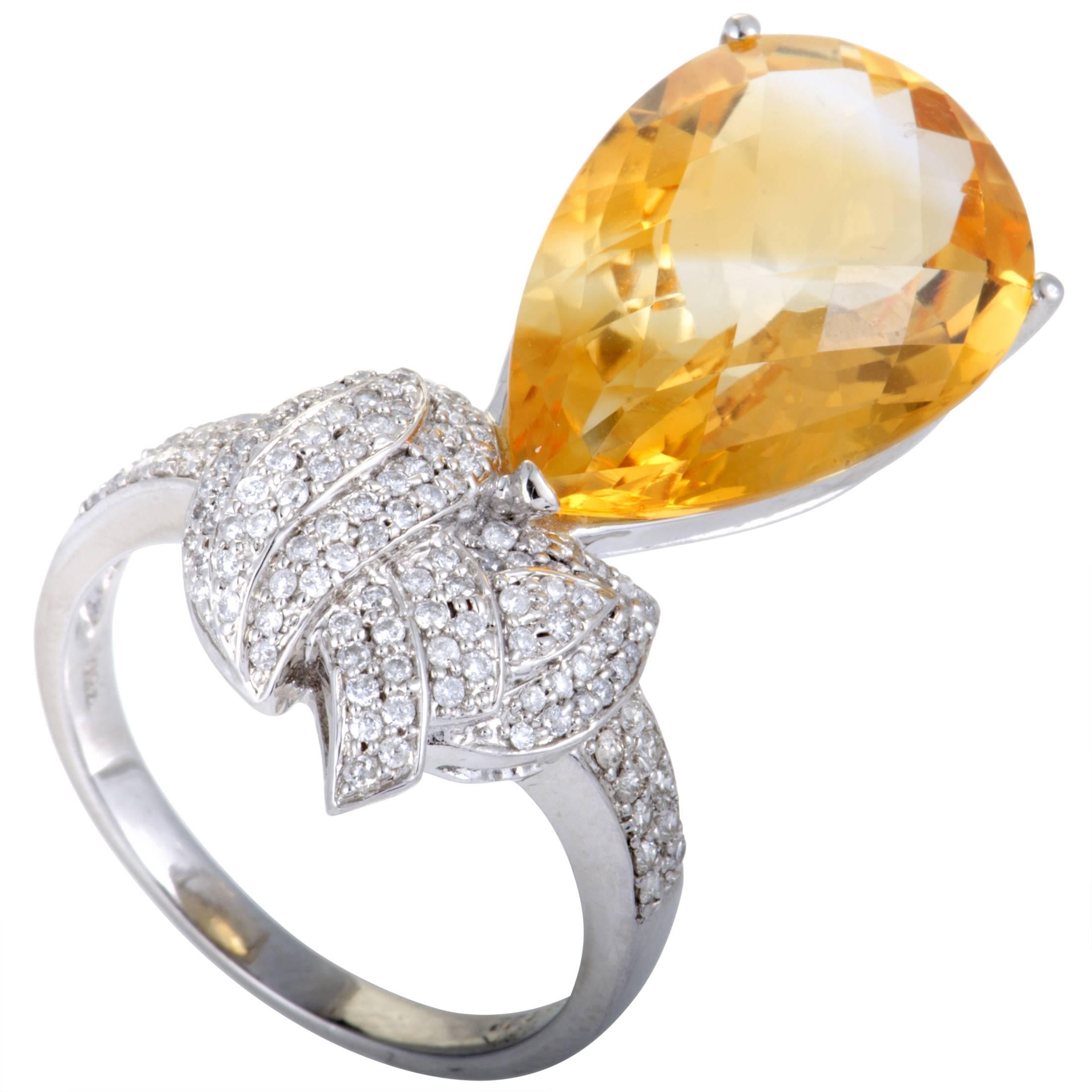 The alluring citrine adds an eye-catching pop of color to this splendid ring that boasts a stunningly offbeat design and lavish décor. The ring is made of 18K white gold and set with a total of 0.60 carats of diamonds, while the citrine stone weighs