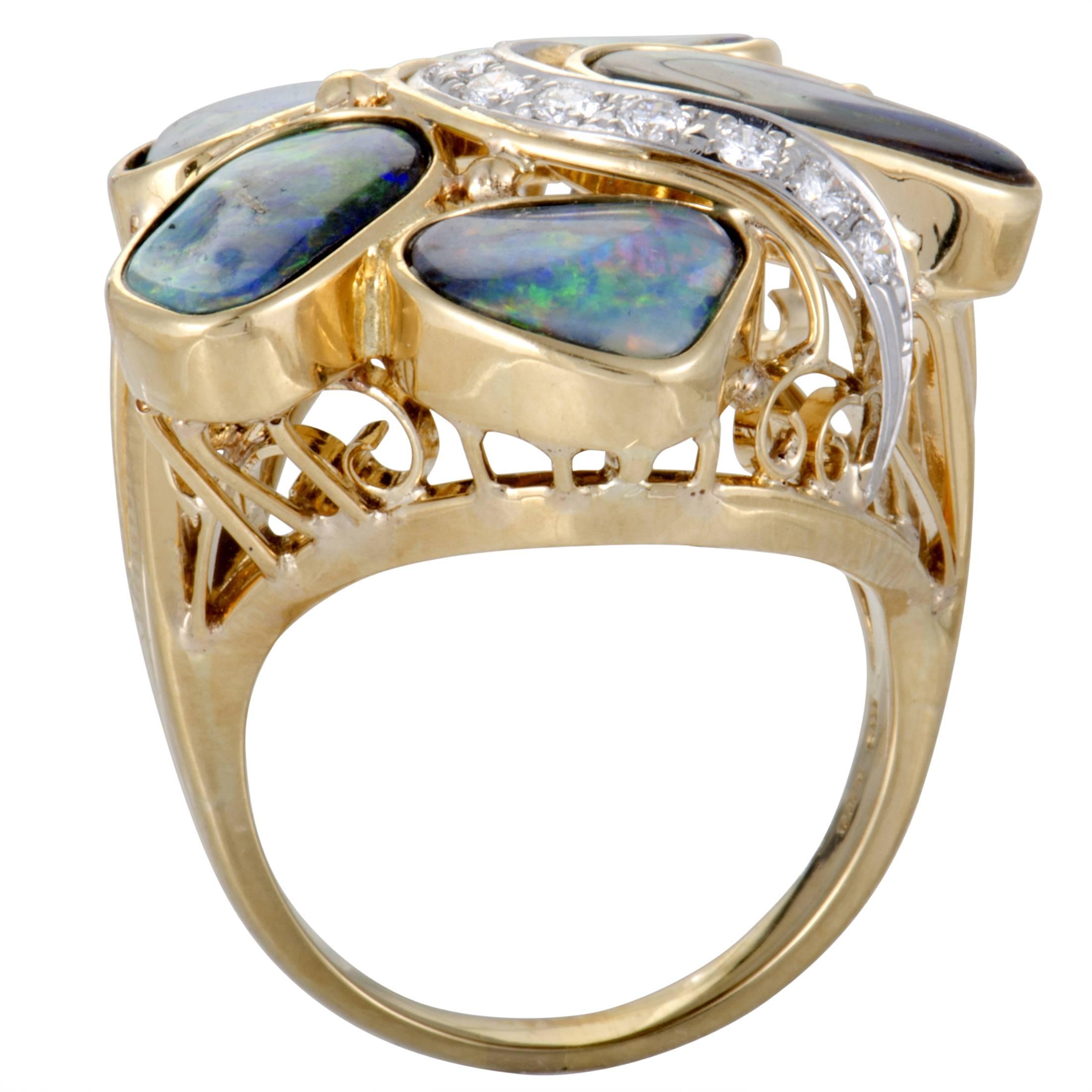 The offbeat design of this stunning ring is taken to a next level by the smart use of striking opals, accompanied by the endearingly scintillating diamond stones. The ring is made of 18K yellow and white gold and boasts a total of 0.28 carats of