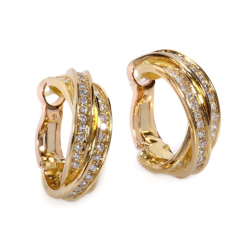 Three bands paired together in harmony create the exciting and innovative design of this pair of Trinity de Cartier earrings. The earrings are made of 18K yellow gold and are set with ~1.23ct of glimmering white diamonds.
Included Items: