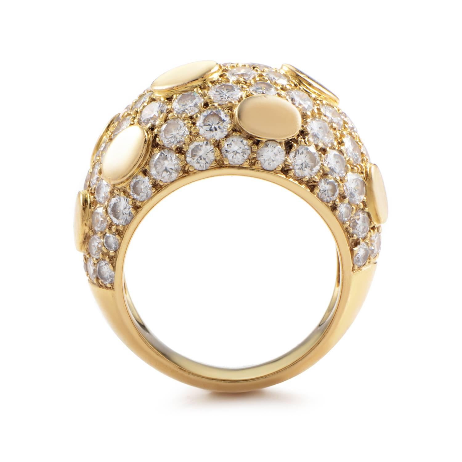 A stunning ring design from Van Cleef & Arpels. The band gathers rapidly into a broad expanse of 18K Yellow Gold. Small islands of the gold rise up from a cascade of 3.90ct diamonds, creating a charming contrast between the precious ingredients.