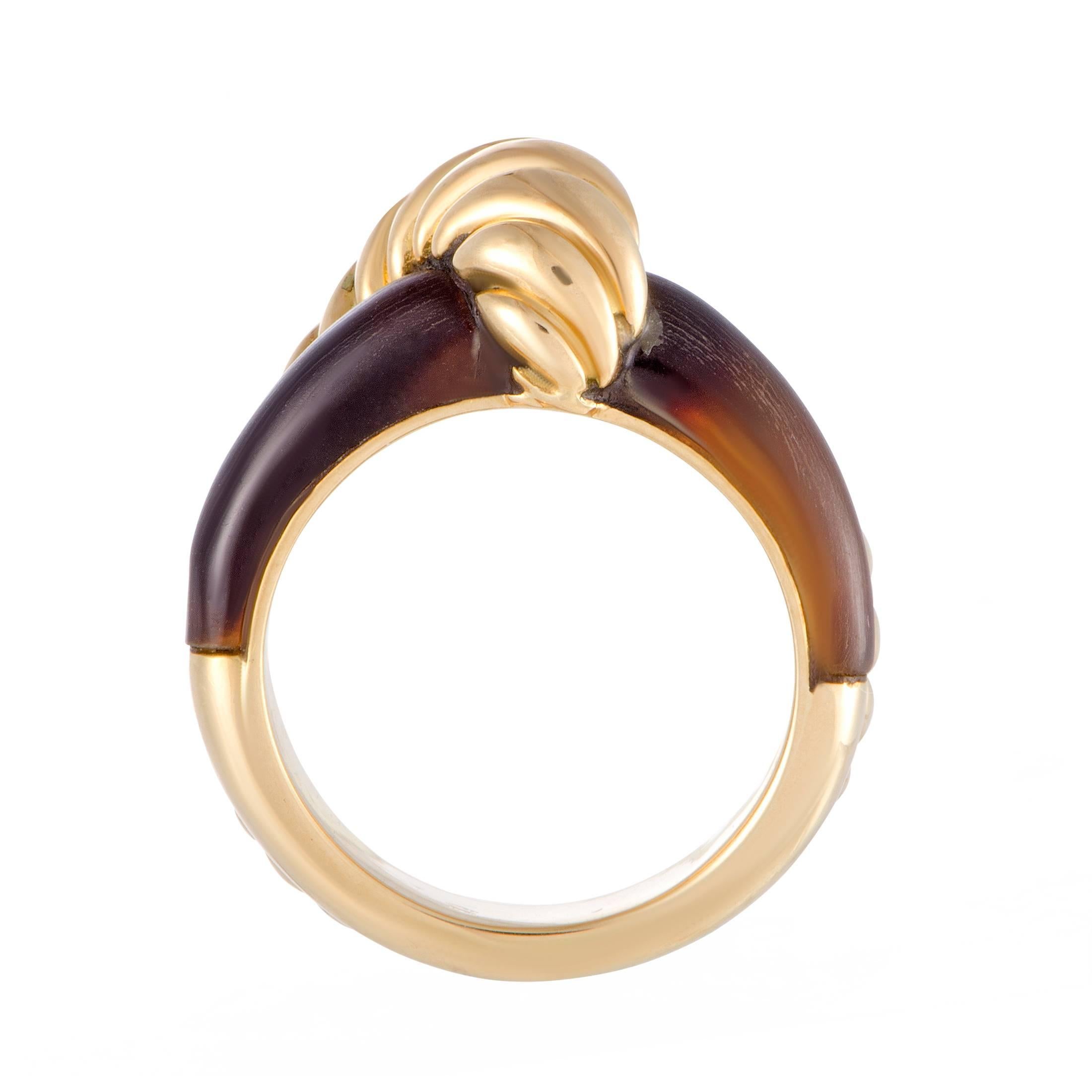 The sophisticated nuance of tiger's eye stone is complemented in wonderful fashion by the luxurious glisten of 18K yellow gold in this splendid ring designed by Hermes that boasts an exceptionally classy appeal.
Ring Size: 5.25
Ring Top Dimensions: