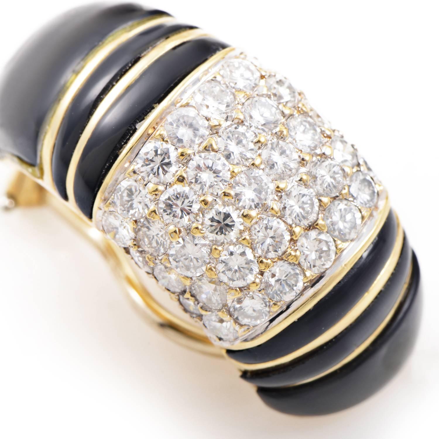 This pair of classic clip-on earrings from the famed Hammerman Brothers are perfect for any occasion. The earrings are made of 18K yellow gold and are accented with a lavish black enamel and a partial pave of white diamonds.
Diamond Carat