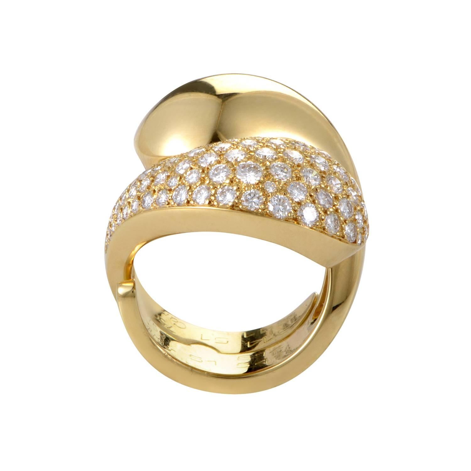 Like embracing tears this Cartier ring spins and folds until its bold swells nestle together at its peak with yin-yang intimacy. One half resonates with pure 18K yellow gold integrity, while the other boasts the added sparkle of meticulously set