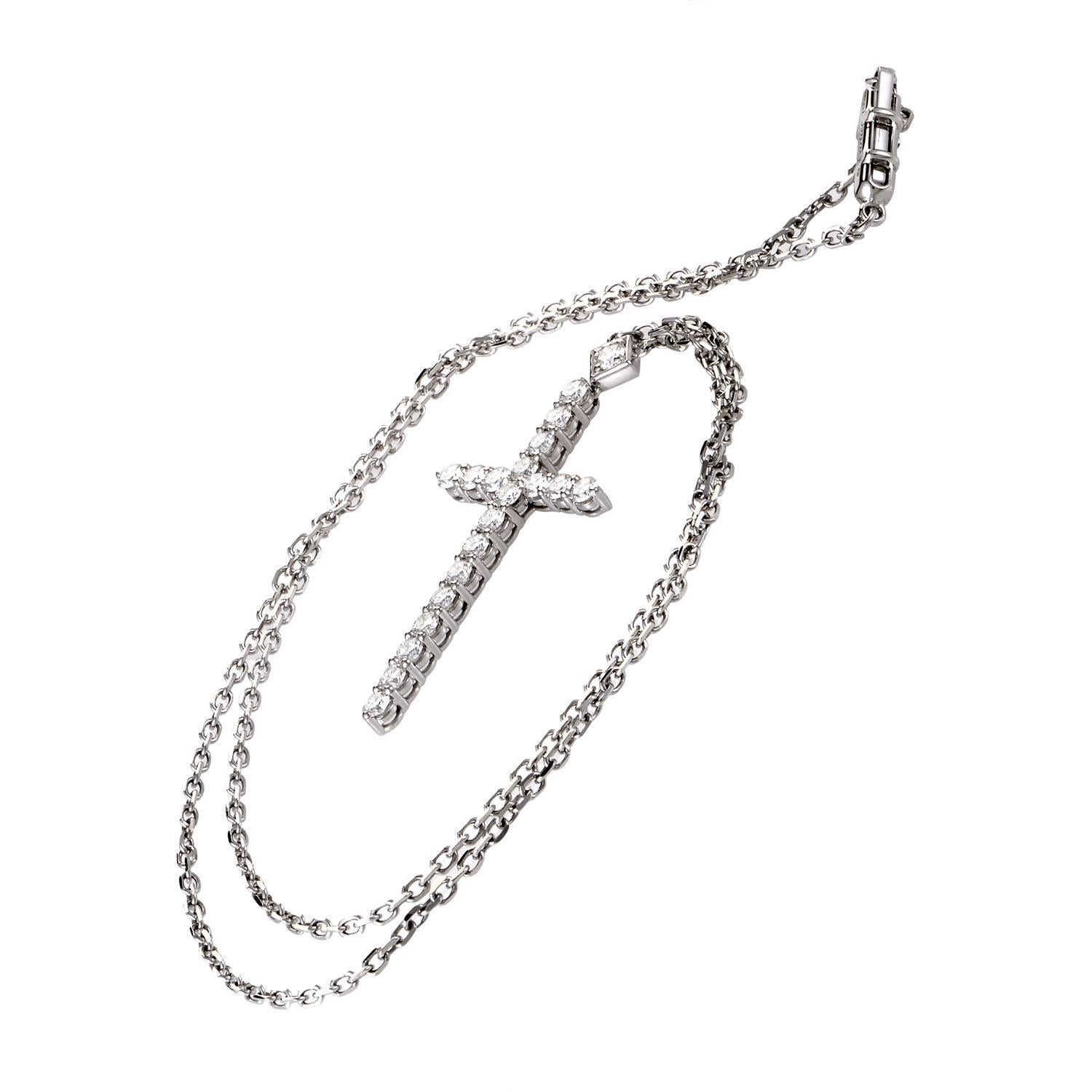 Cartier adds luxury to majesty with a necklace suspending a finely forged cross motif. Thin links of 18K white gold drop over a dazzling junction of 1.50ct diamonds. A single, larger cut of diamond rests at its crown. This fine example of luxury
