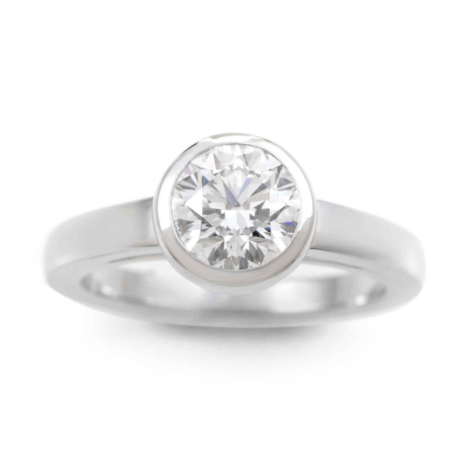 There's nothing minimal about this magnificent engagement ring from Cartier. On the unquestionable strength of a single 1.05ct three time cut diamond solitaire, this glittering beauty exudes luxury from every angle. Giving regal support to this
