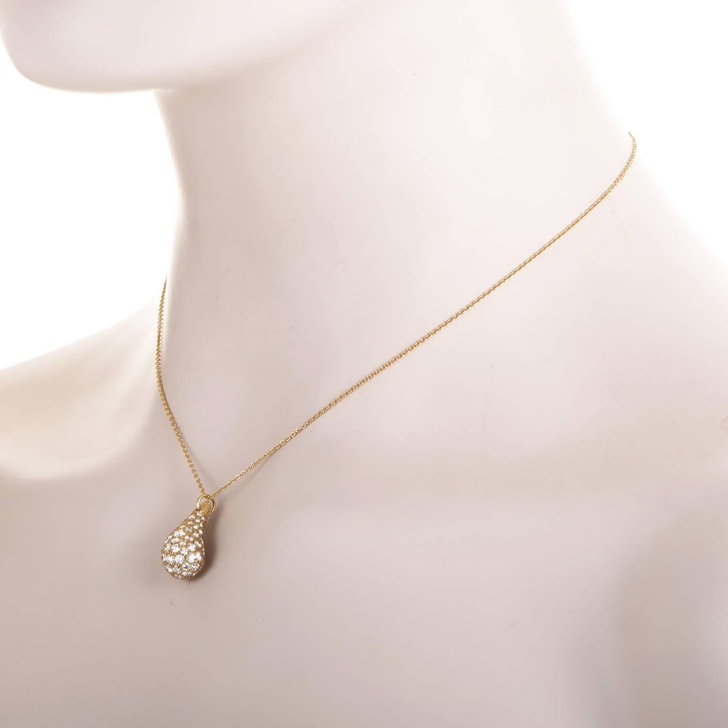 Elsa Peretti infuses the Tiffany brand with her unique sense of deign with this teardrop necklace. 18K yellow gold is beautifully shaped into a curling tear. Its shine is provided by the unsparing application of 3.60ct of diamonds. The pendant hangs