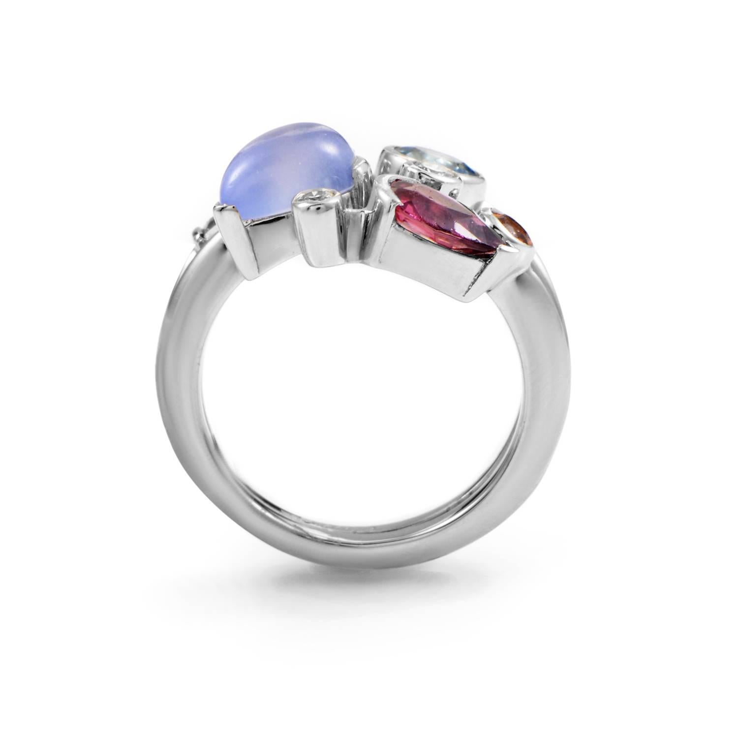 This ring design from Cartier is a veritable bouquet of luxury. Platinum provides the sturdy vine, curling with perfection into a forked band. From the rising band an abundance of precious stones blossom in sparkling abundance and myriad hues. This