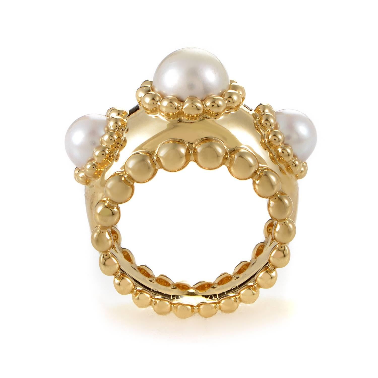 The oceanic majesty of pearls is the theme running through this luxuriously bold ring design from Chanel. It begins with the 18K yellow gold band which ascends between gathering rows of monuments to the pearl, their symmetry perfectly forged off the