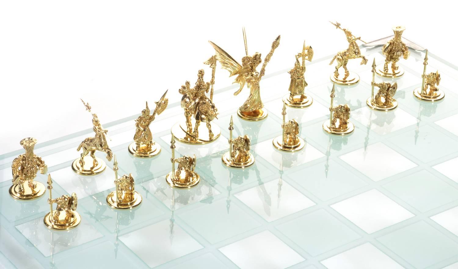 The foremost game of strategy unfolds between the most fantastic cast of characters with this unique and stunning handmade, custom designed chess set. Consider first the sheer weight of gold dedicated to this design; 62.2 grams shape the corners,