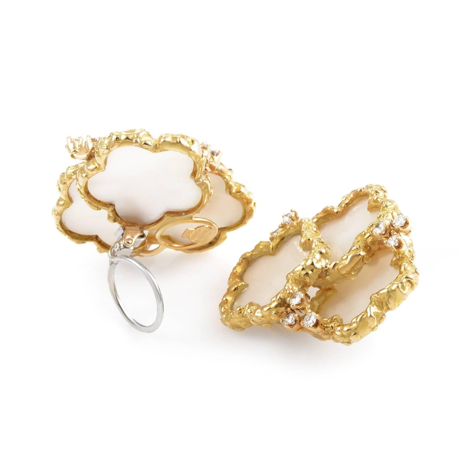 Layered textures resonant of the ocean's wonders give mystical glamour to this earring set from Chaumet. 18K yellow gold spreads and thins into three tiers of floral frames. Within the gold's perimeter are stretches of mother of pearl, their