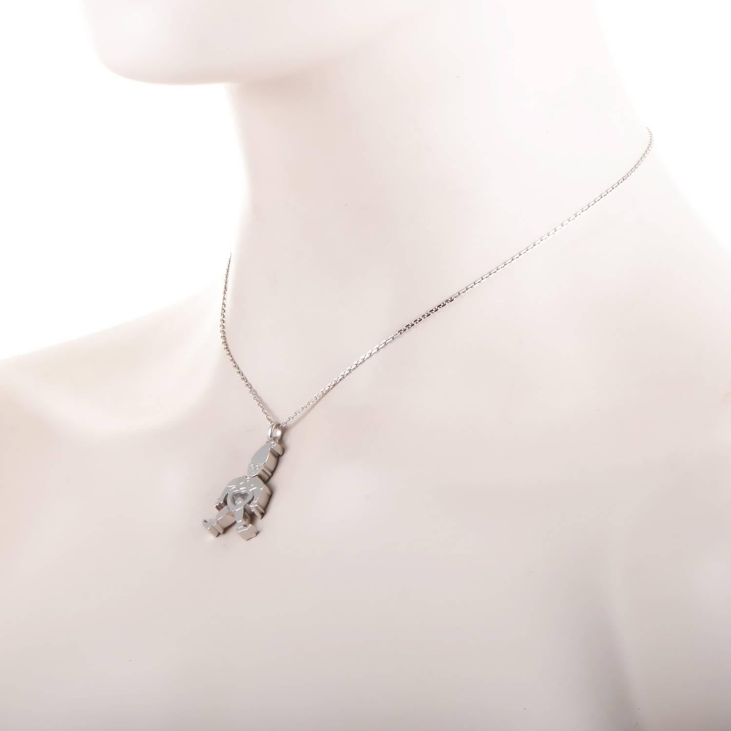 Mischief and mystery abound with elfin charm. 18K white gold is playfully molded into the limbs, torso and grinning face of an elf. With cap, bow tie and curl-toed boots included, this seasonal character's heart is out in the open. The glistening