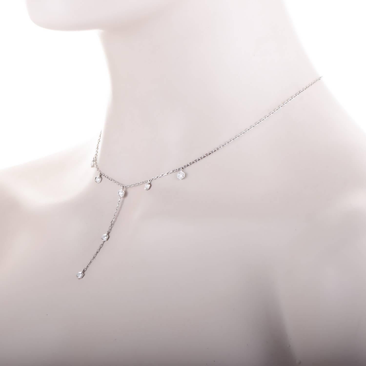 Like trickling raindrops in the echo of a storm, the drop of this necklace spills in shimmering style. Settings of 0.50ct of diamonds taper down the neckline, converging into a single stream on the 18K white gold chain. Feminine grace is captured