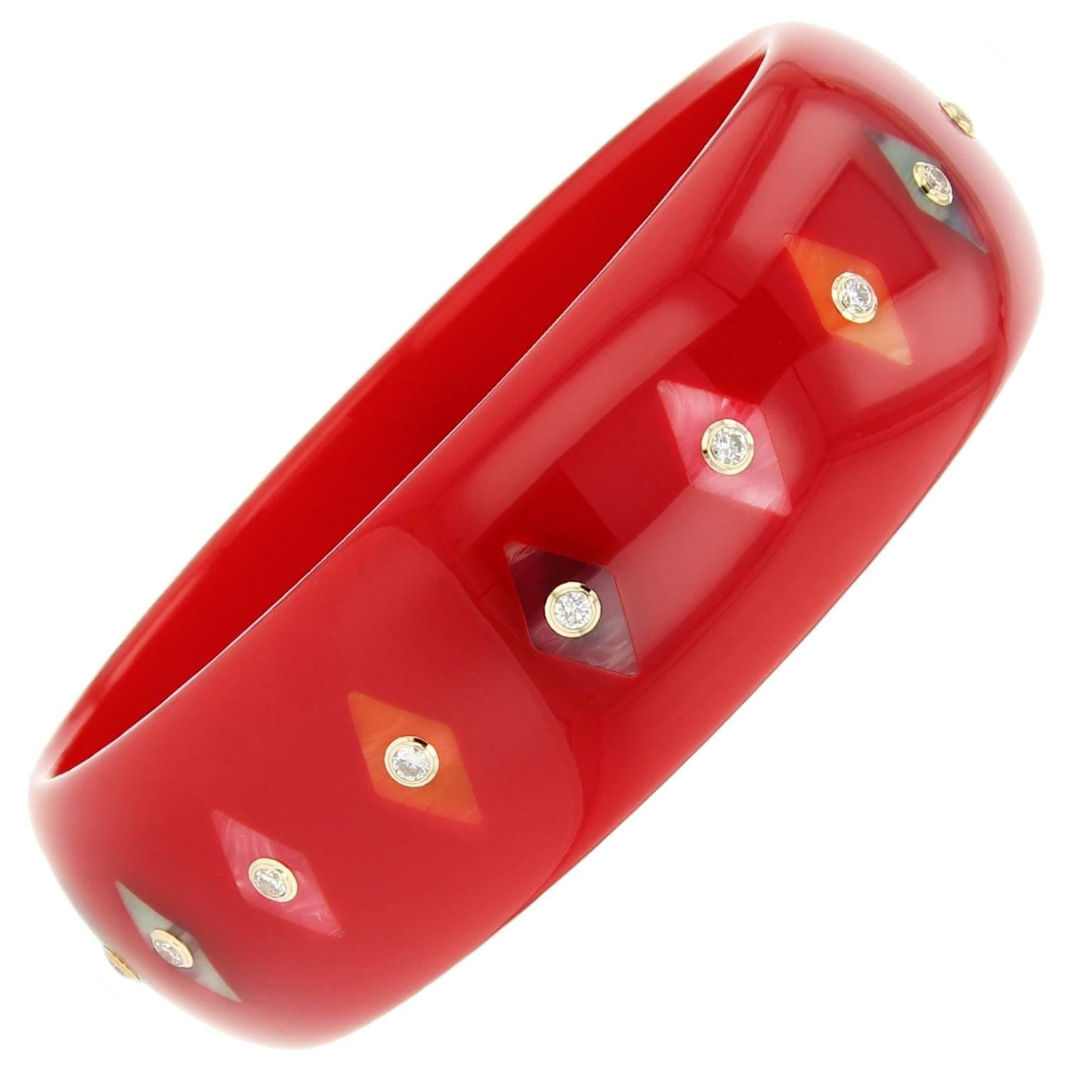 This Mark Davis bangle was handcrafted using red, blue, orange and pink vintage bakelite. Inlaid with multi-colored kite shaped bakelite pieces and centered with diamonds set in 18k yellow gold bezels.  

Full details below: 
• From the Mark Davis