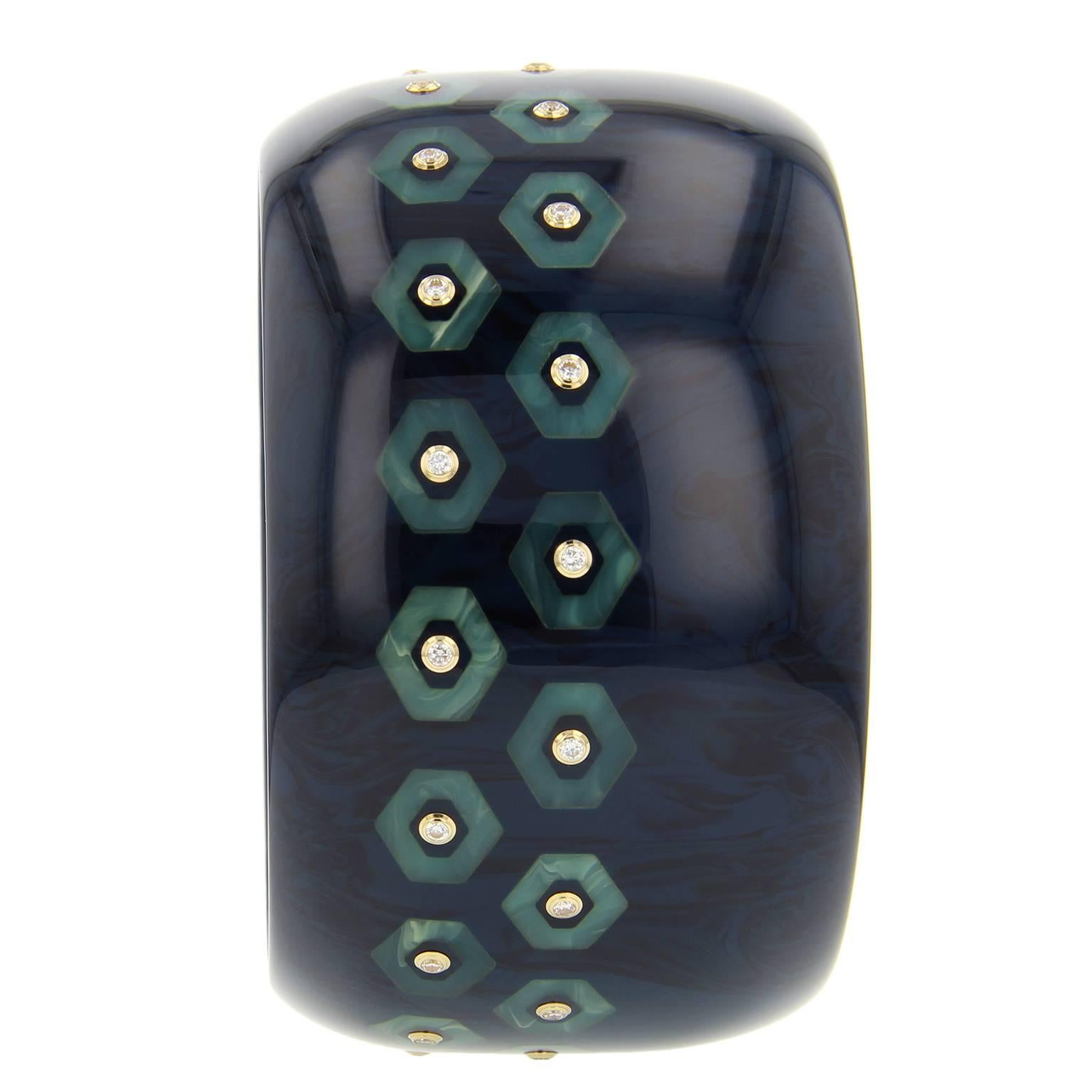 This bold and elegant bangle was handcrafted of subtly marbled blue and black vintage bakelite. Part of the Mark Davis Collector line, it was precisely inlaid with pieces of light blue bakelite.  Each hexagon is centered with a fine diamond