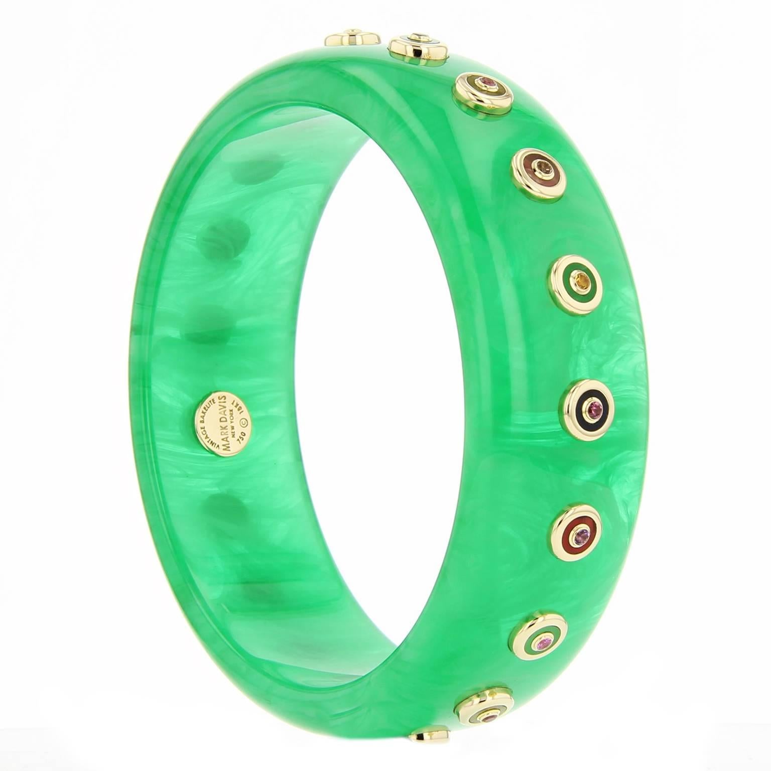 This unique Mark Davis bangle was handcrafted using translucent green vintage bakelite. Each 18k yellow gold stud is inlaid with various multi-colored bakelite pieces and topped with amethyst, citrine, garnet, peridot, or pink, yellow and blue