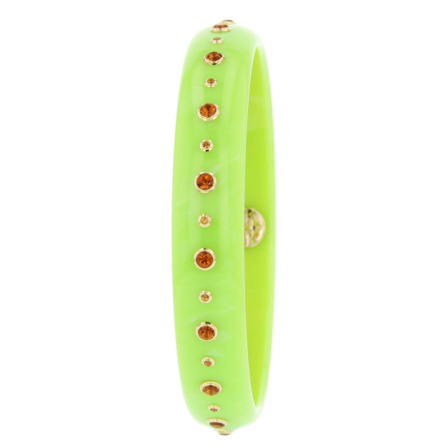 This vibrant bangle is part of the Mark Davis Bakelite Collection. It was handcrafted using electric green vintage bakelite and studded with citrine  bezel-set in 18k yellow gold.    

Full details below: 
• From the Mark Davis Bakelite Collection