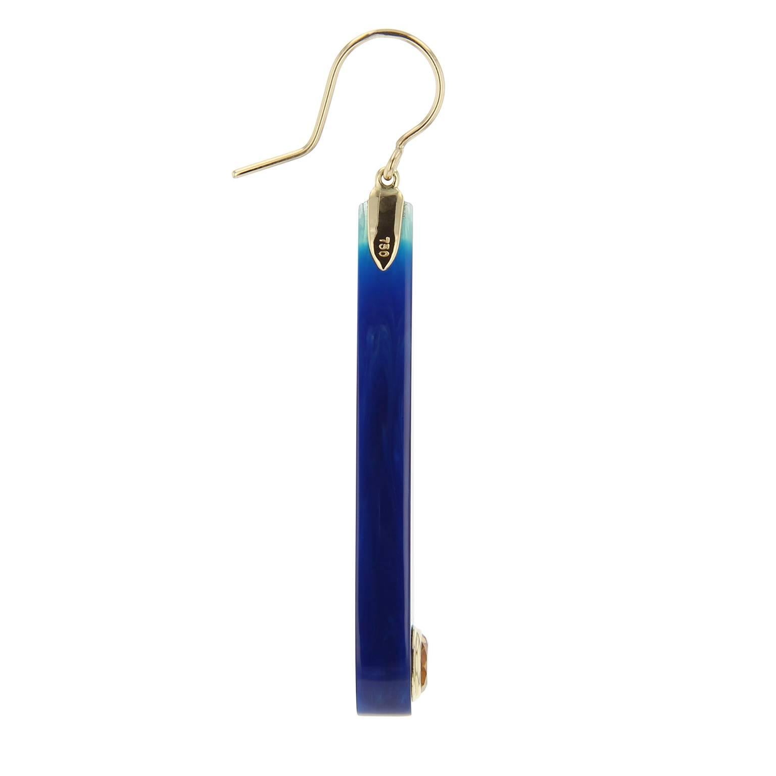 These Mark Davis elongated teardrop earrings are created from meticulously laminated vintage bakelite in various shades of blue.  A large citrine, bezel-set in 18k yellow gold is the perfect accent at the bottom.  

Full details below: 
• From the
