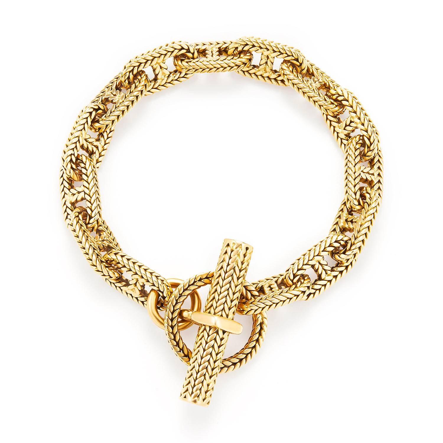 Designed as a heavy textured 18k gold anchor link bracelet with toggle clasp, with an Hermes box.  This exquisite Chaine D Ancre bracelet is an original, made by George L'Enfant for Hermes.  In addition to the Hermes stamp, it also includes the