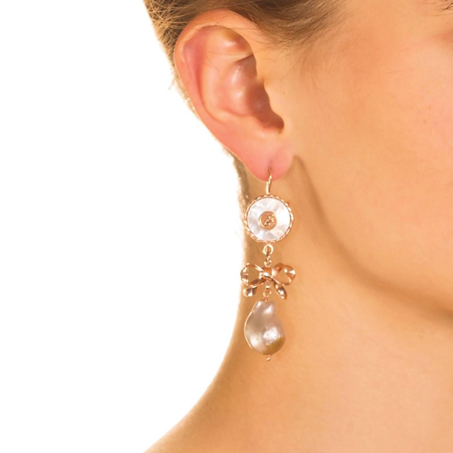 Victorian style with a modern edge, these graceful, feminine earrings are an expression of simple elegance.   Three elegant components combine to create a sophisticated work of wearable art.  Start with our classic ‘Simply Chic’ top – a CdG coat of