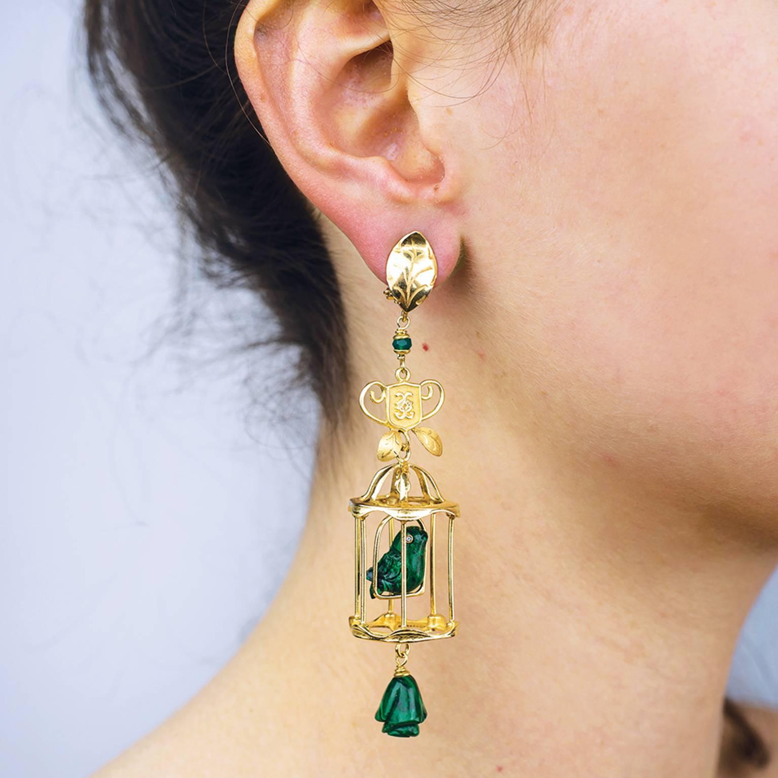 These lovebirds are the most charming VALENTINES gift! The earrings feature an open cage of 18 karat yellow vermeil sheltering delicate lovebirds sculpted from deep green malachite. Singing happily into your ear, the birds’ eyes twinkle with Top