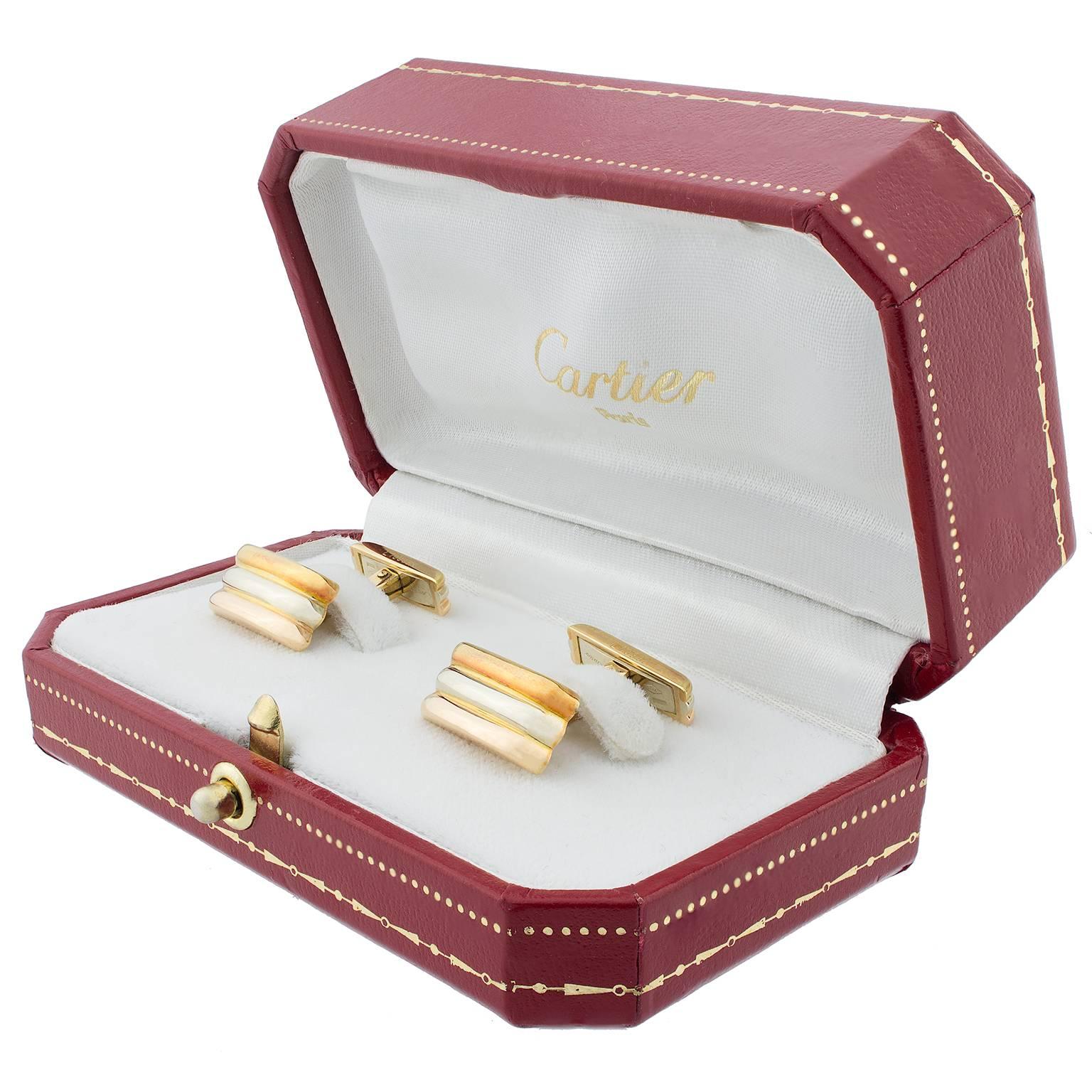White, rose and yellow gold cufflinks by Cartier, from the Trinity de Cartier collection. Original box included.