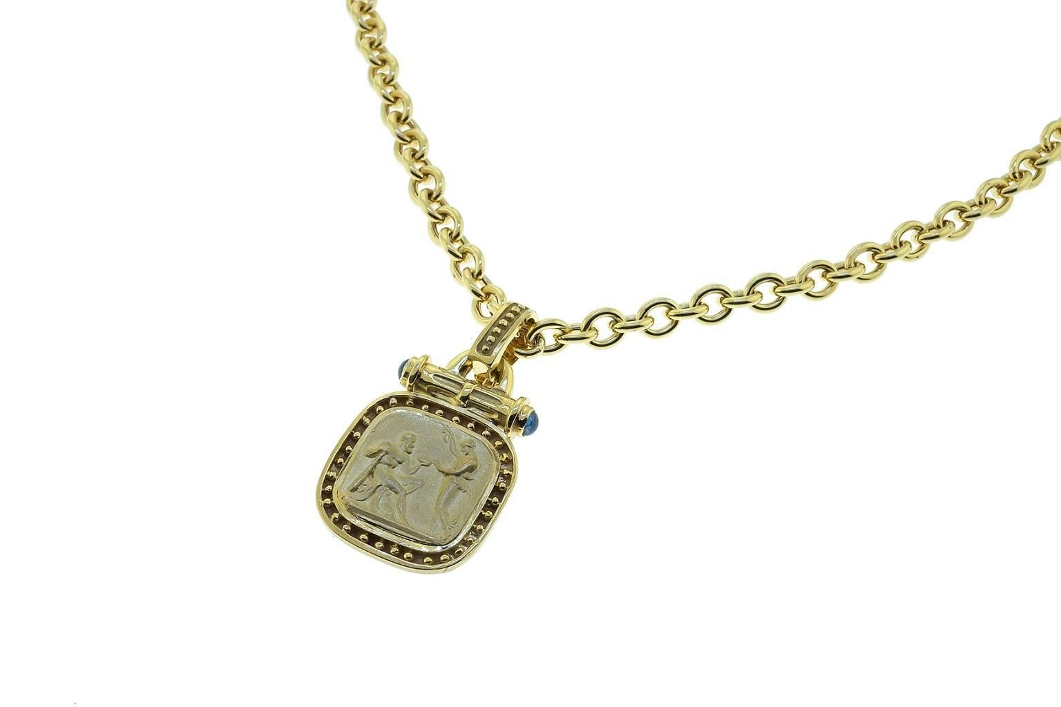 14K yellow gold roman scene design enhancer with sapphire cabochons.
Necklace can be purchased separately
