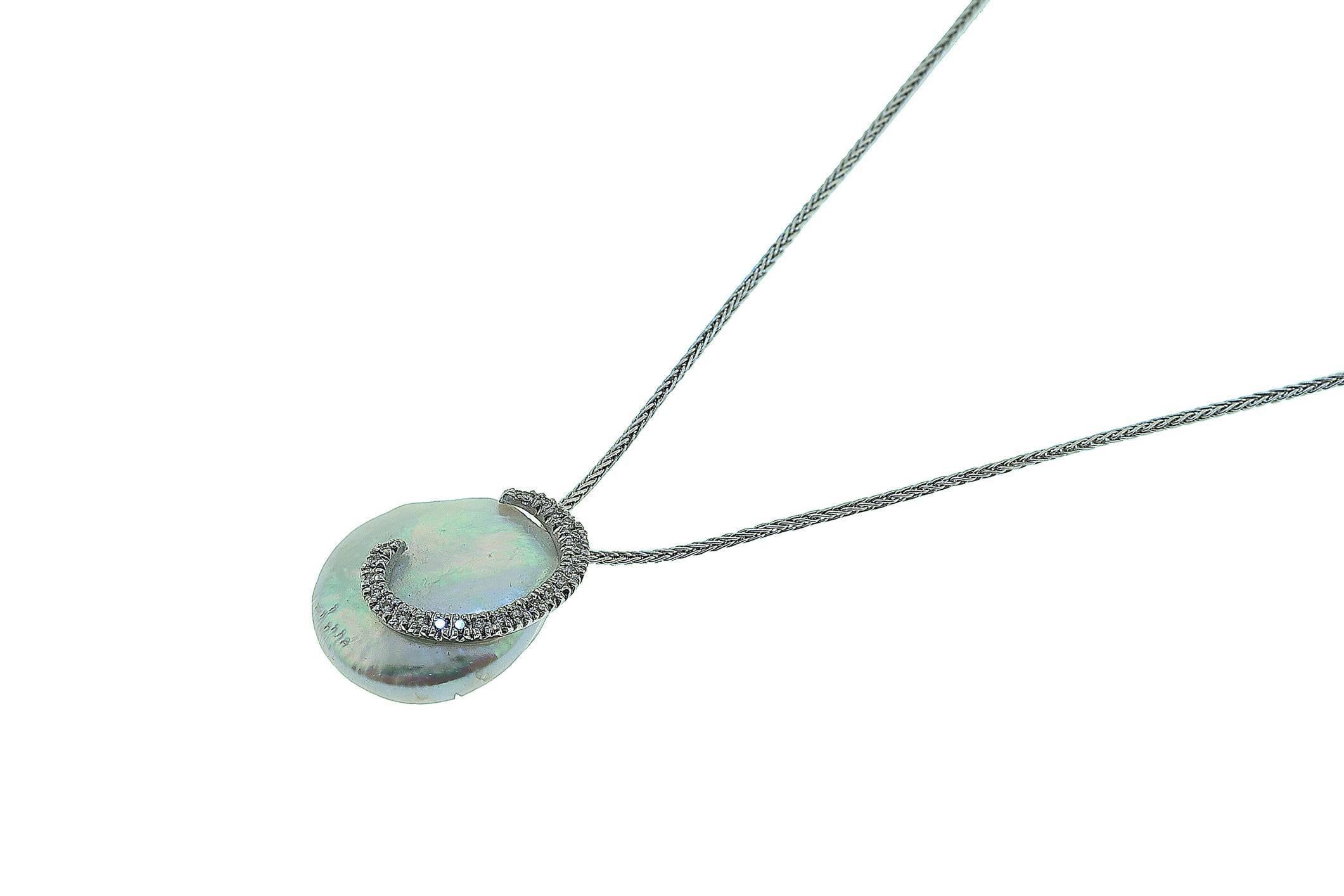 18K white gold Biwa pearl with diamond swirl. The diamonds weigh combined 0.26 carat. The pendant hangs on a 16