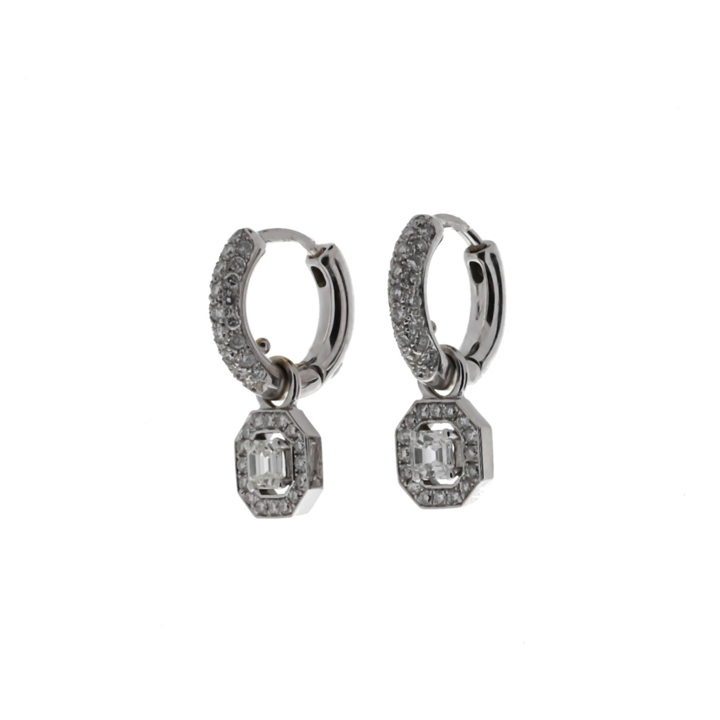Oliva diamond dangle earrings containing two ascher cut diamonds weighing combined 0.70 carat and 82 pave set round diamonds weighing combined 0.77 carat.