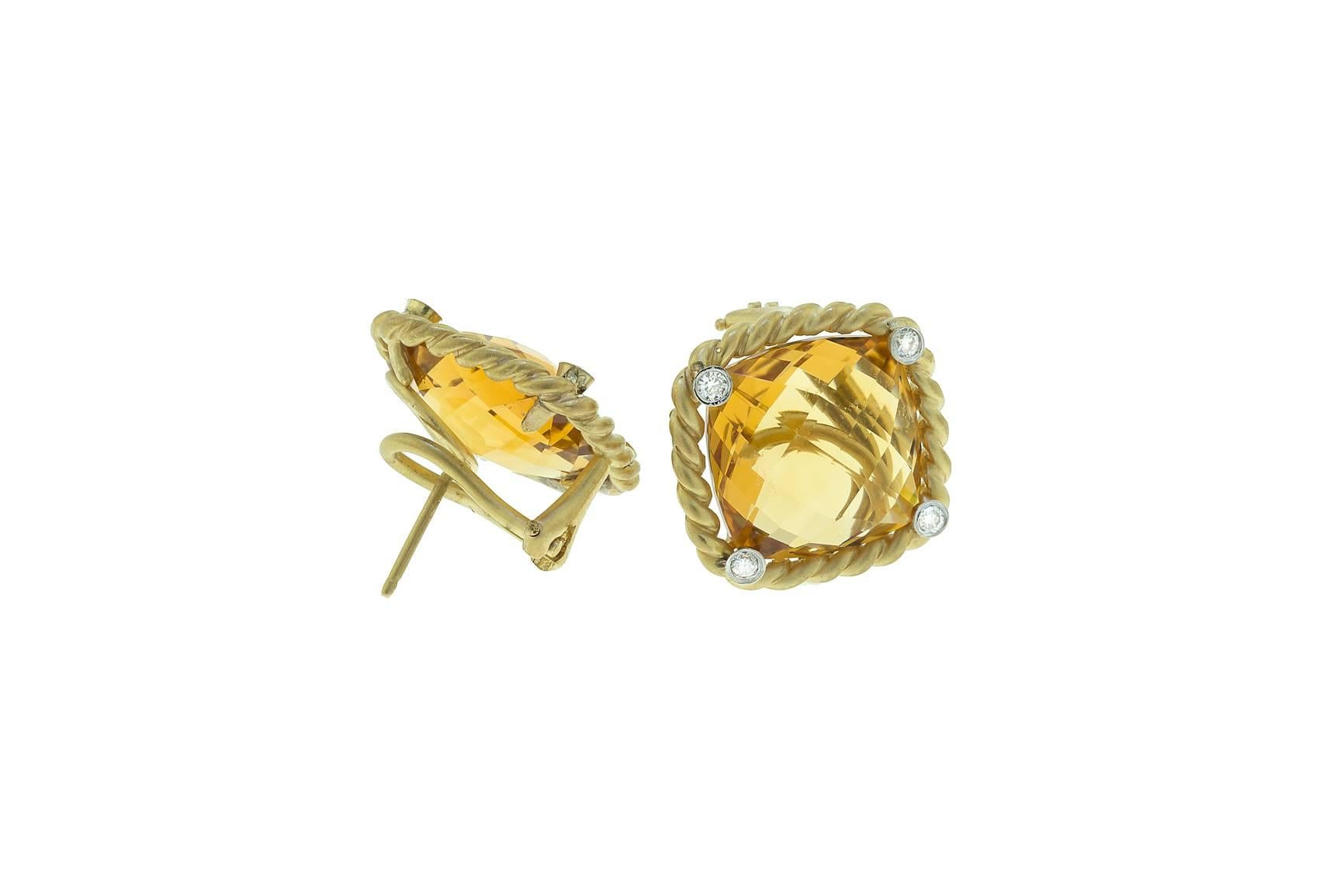 14K yellow gold earrings with checkerboard cut citrine and eight diamonds weighing combined 0.24 carat.