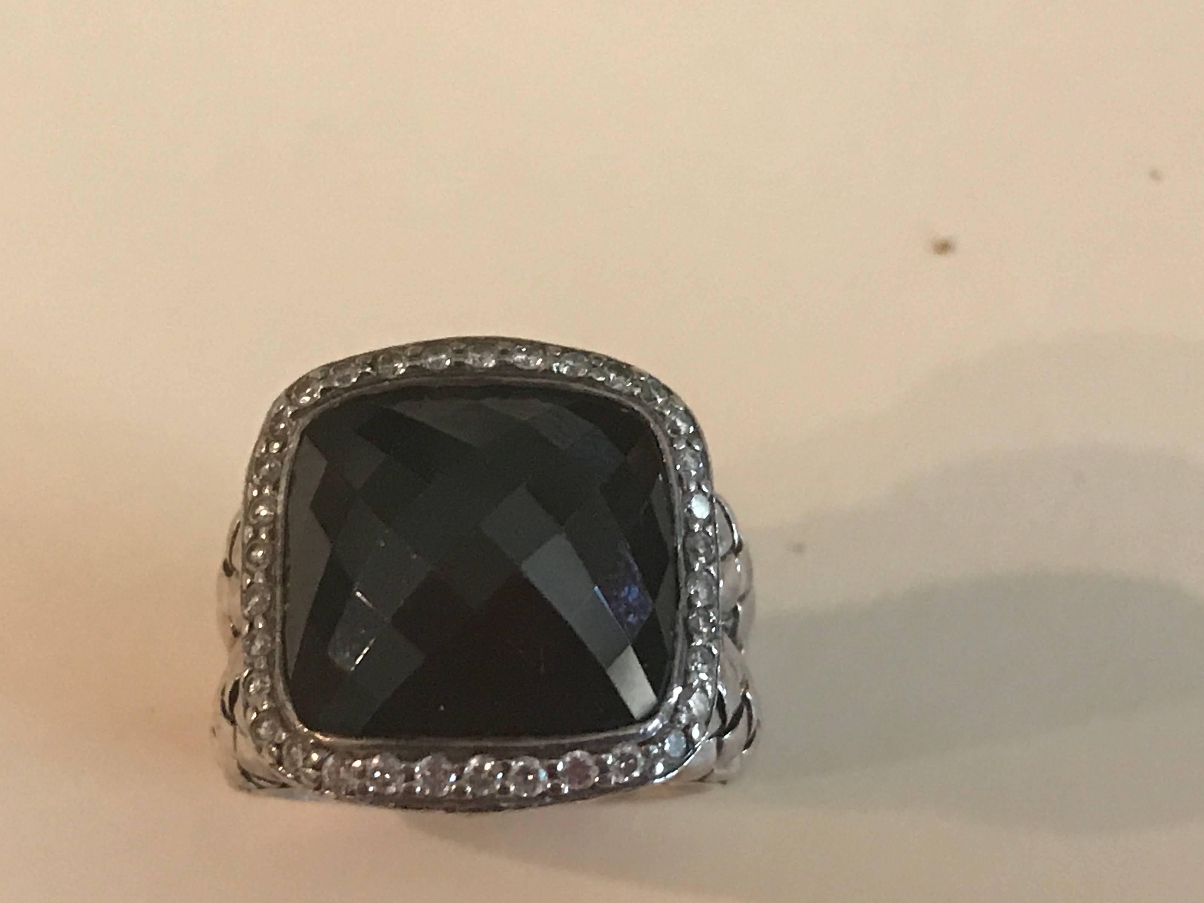 Sterling silver faceted black onyx and diamond ring.
