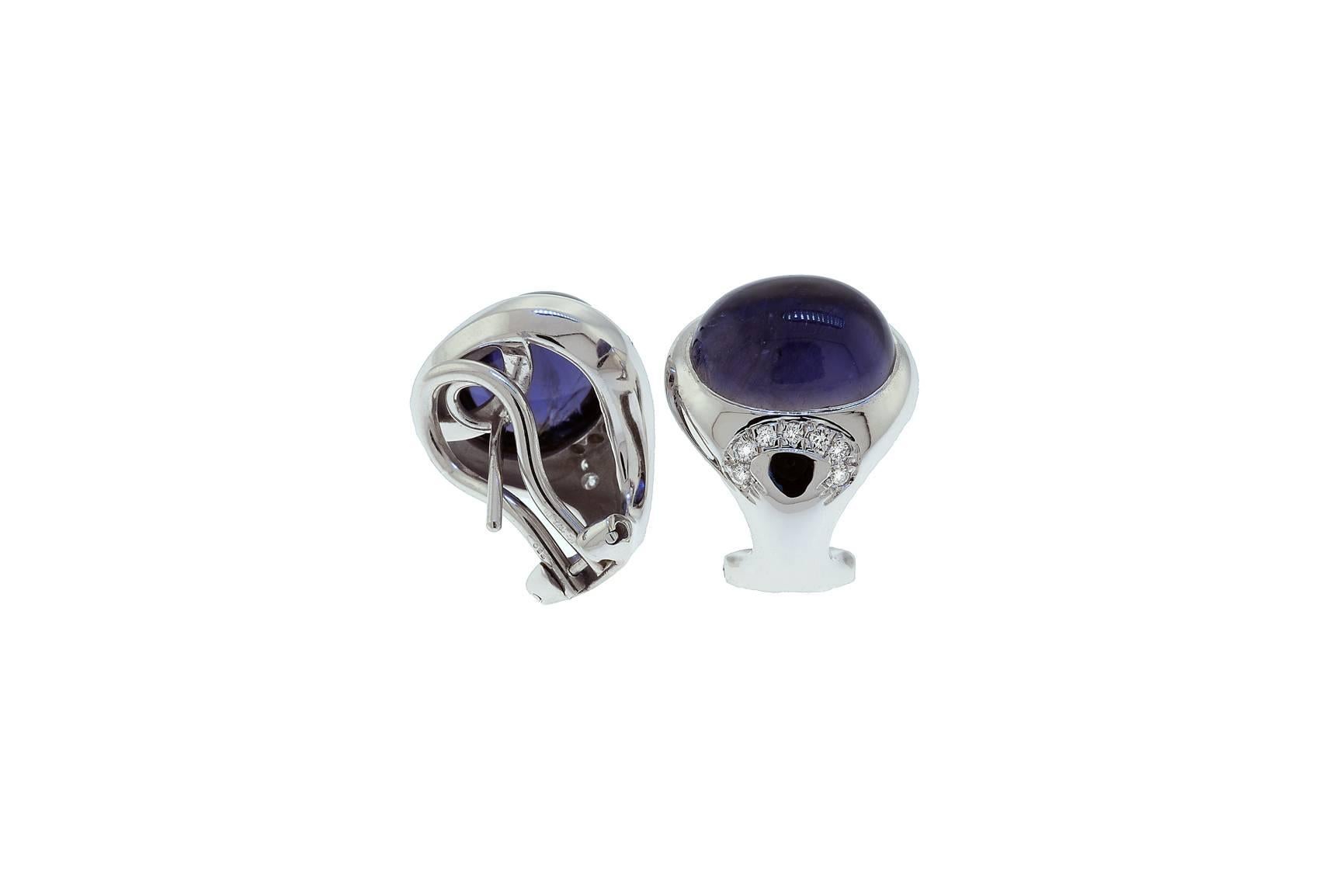18K white gold earring with Iolite cabochons and diamonds. Each iolite cabochon measures approximately 10x12mm. The earrings have a clip and a post.