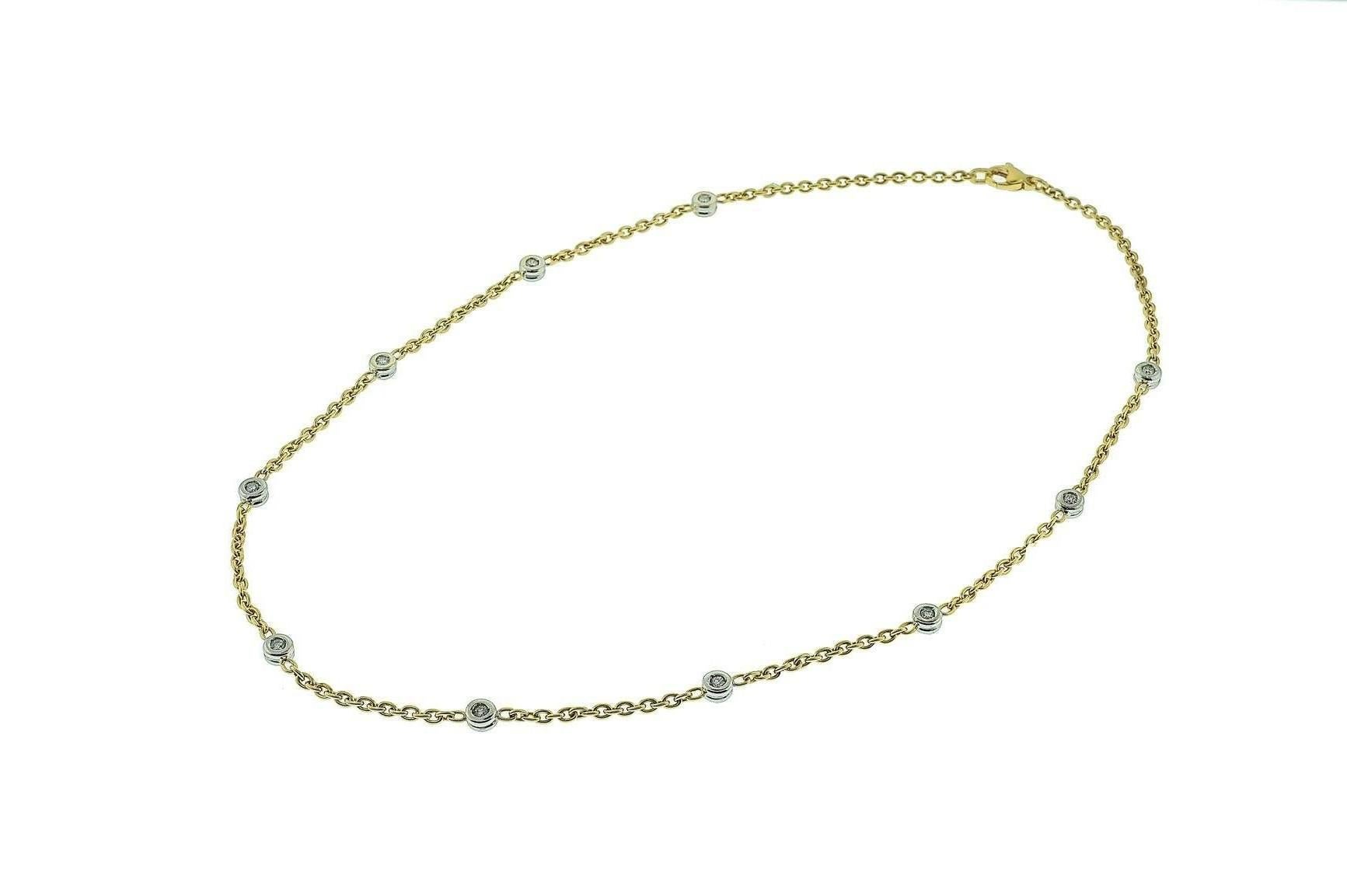 18K yellow and white gold diamond chain necklace. The necklace contains 20 diamonds weighing combined 1.00 carat. The diamonds are bezel set and each station contains 2 diamonds, one on each side.